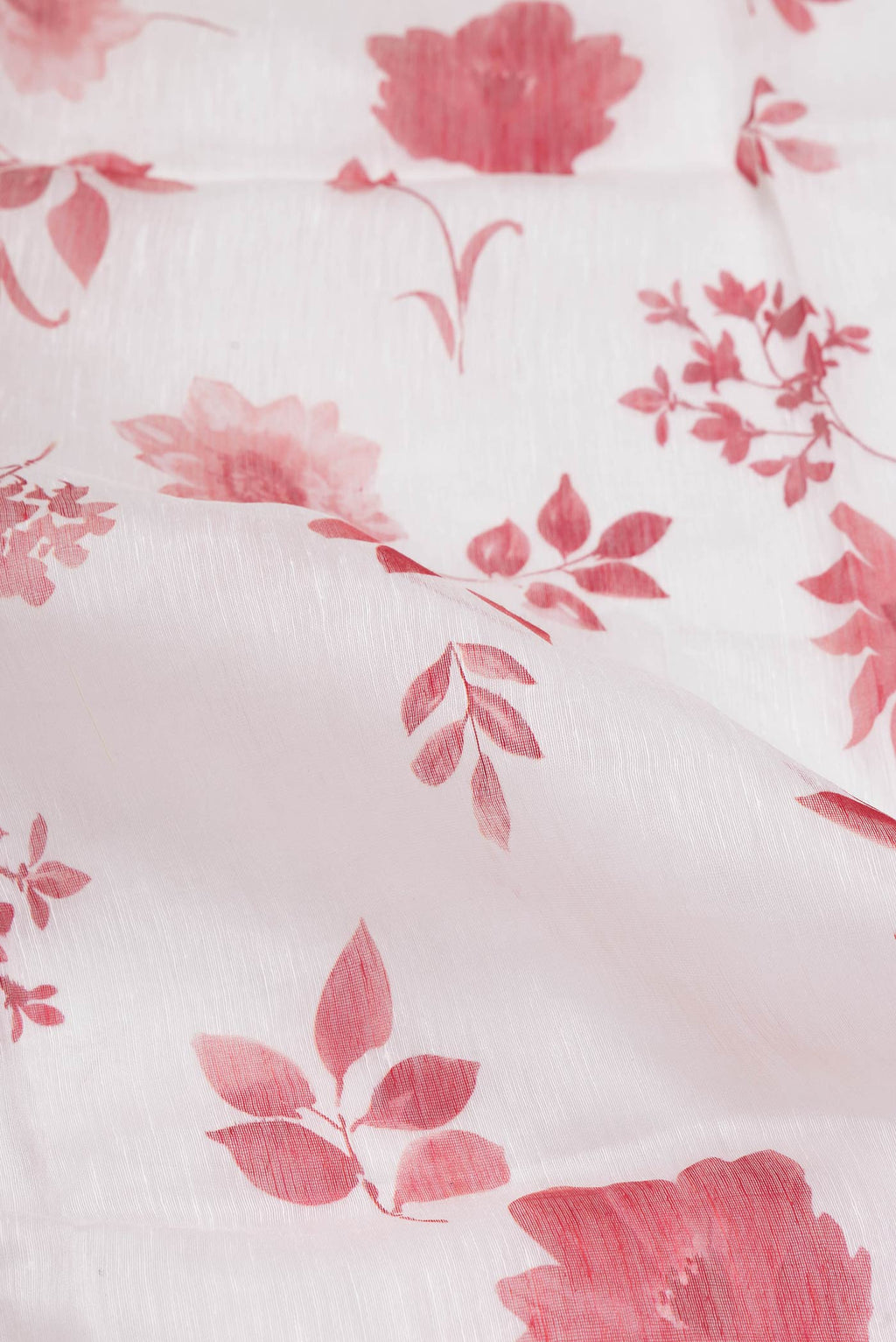 Close up of Off White Dual Tone Linen Saree with Printed design on the body and Plain Border.  displaying folds