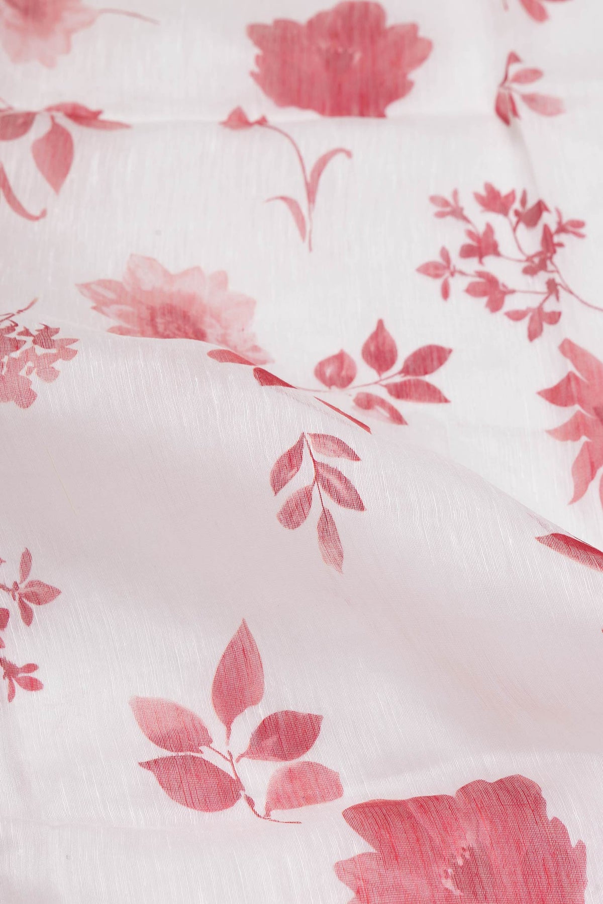 Close up of Off White Dual Tone Linen Saree with Printed design on the body and Plain Border.  displaying folds