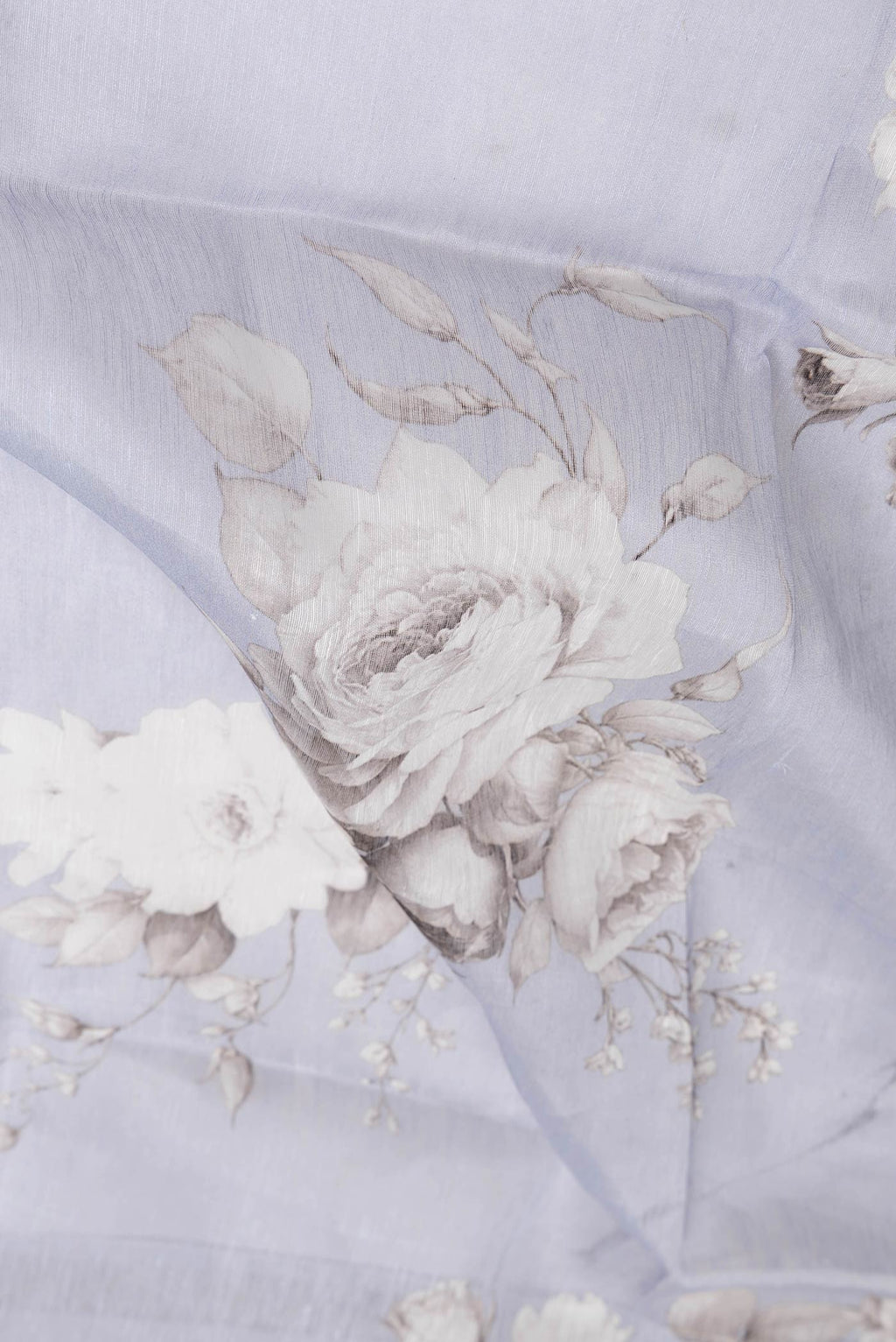 Close up of Lavender Dual Tone Linen Saree with Printed design on the body and Zari Border.  displaying folds