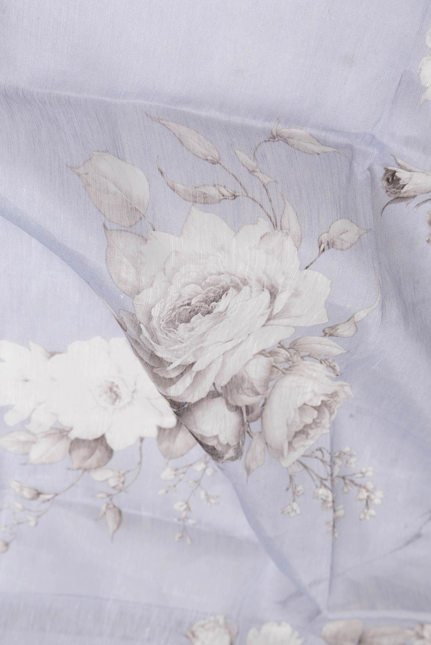 Close up of Lavender Dual Tone Linen Saree with Printed design on the body and Zari Border.  displaying folds