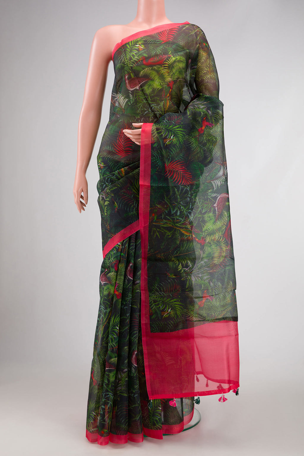 Bottle Green Dual Tone Organza Silk Saree with Printed design on the body and Zari Border.  displayed on a mannequin