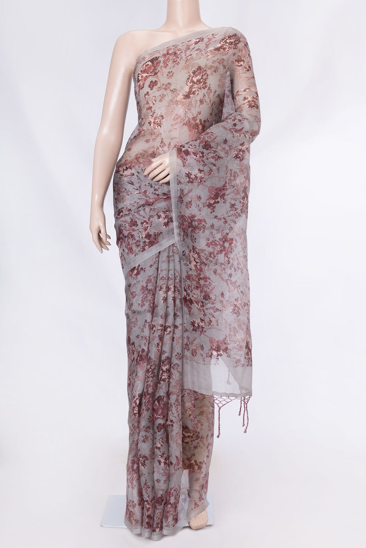 Grey Dual Tone Organza Silk Saree with Printed design on the body and Without Border displayed on a mannequin