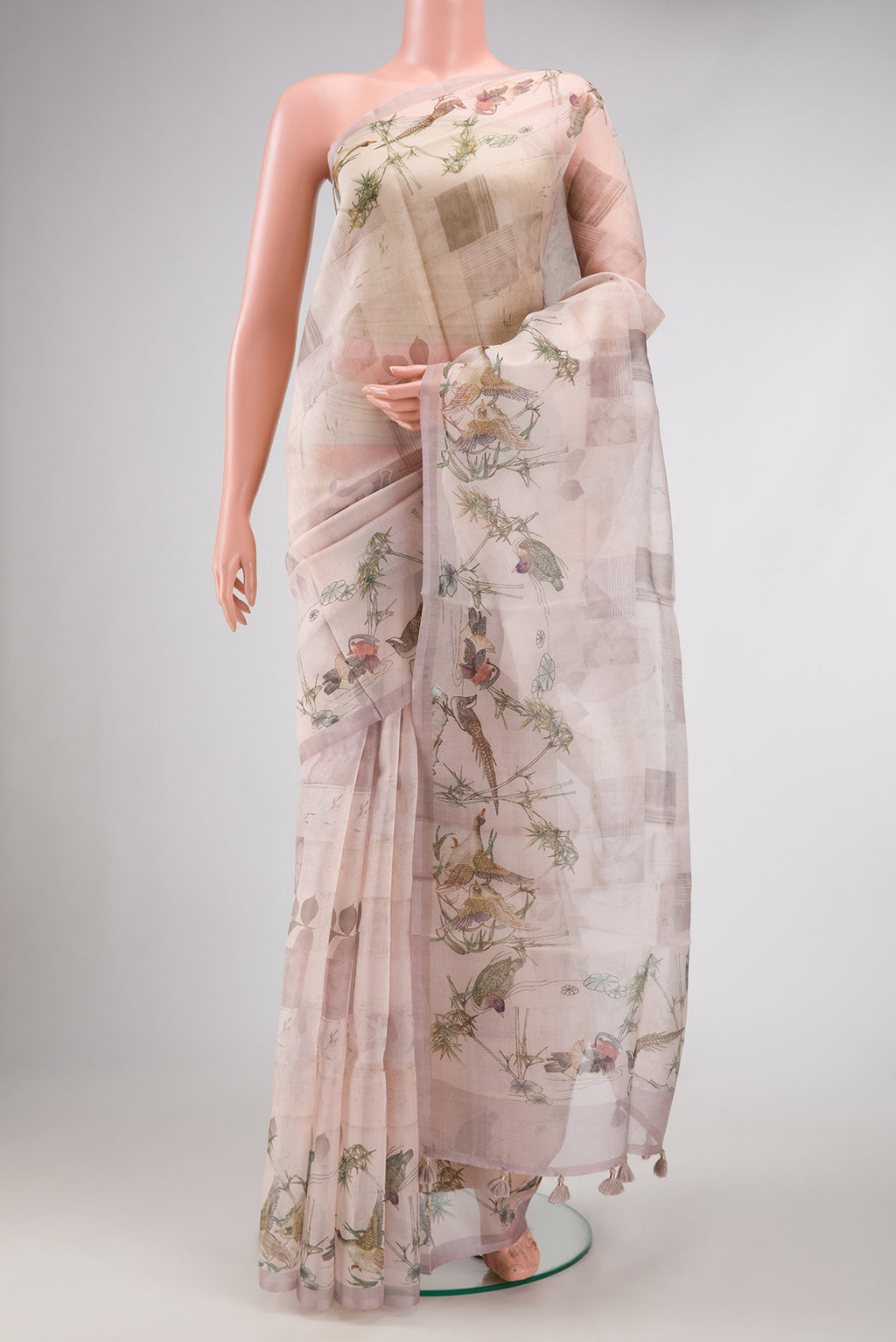 Rose Gold Dual Tone Organza Silk Saree with Printed design on the body and Printed Border.  displayed on a mannequin