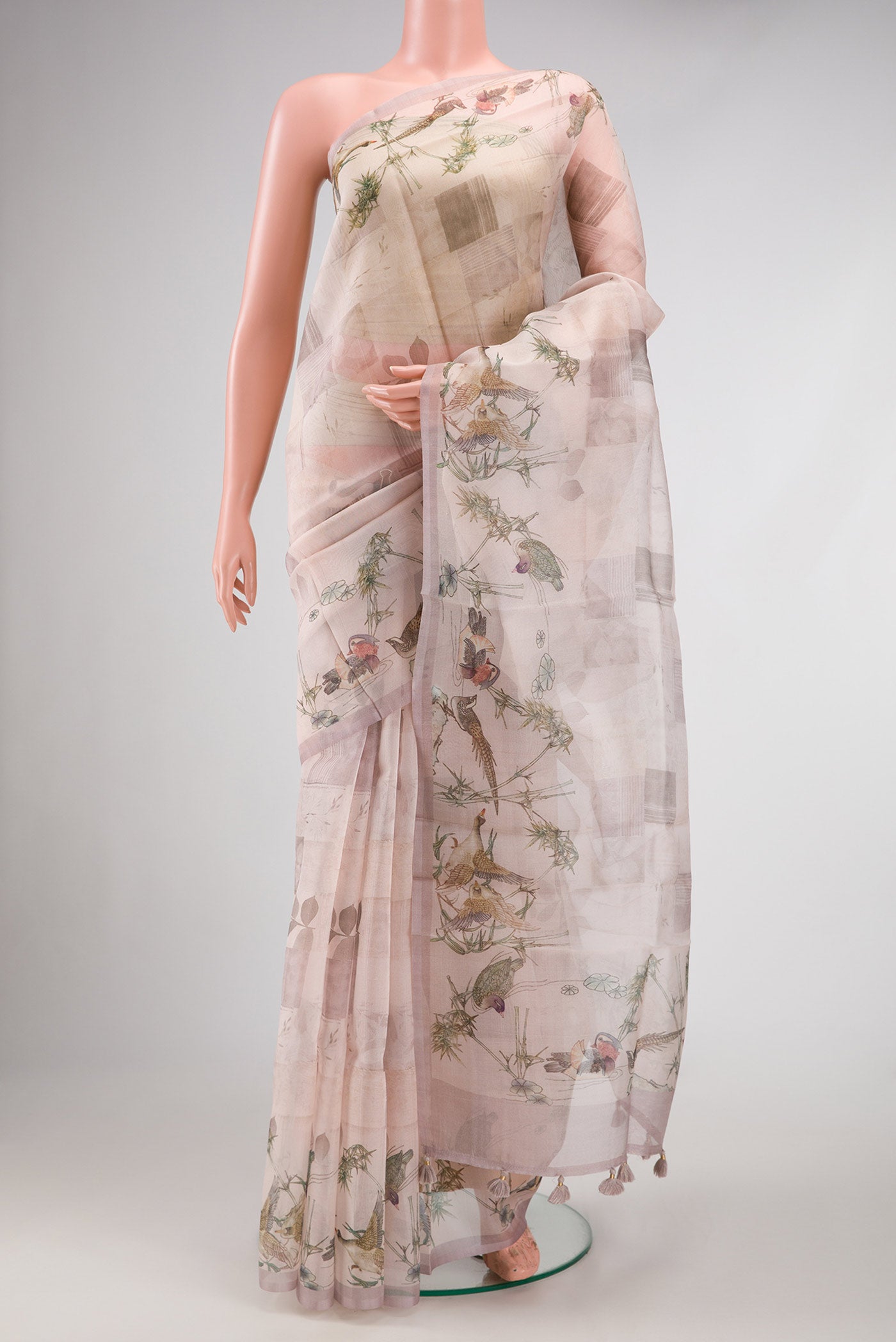 Rose Gold Dual Tone Organza Silk Saree with Printed design on the body and Printed Border.  displayed on a mannequin