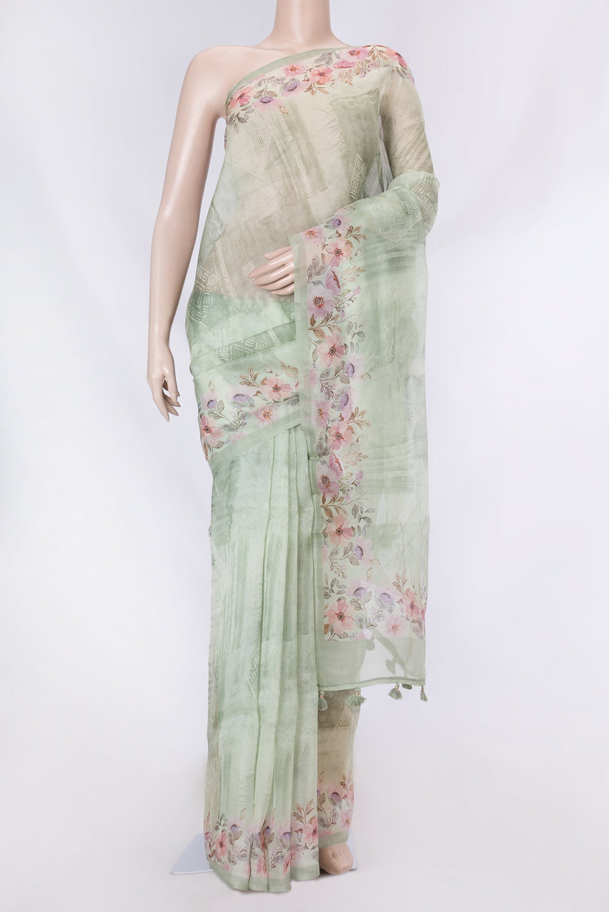 Pista Green Dual Tone Organza Silk Saree with Printed design on the body and Printed Border displayed on a mannequin