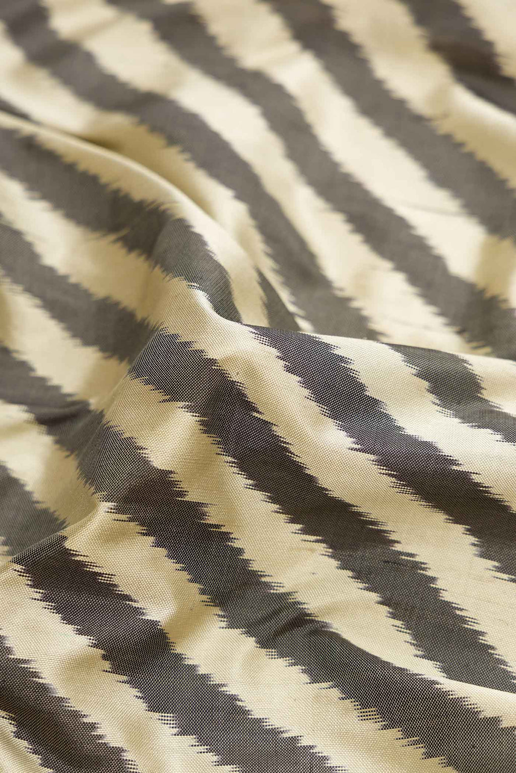 Close up of Multi Color Pochampally Silk Saree with Pure Ikat on the body and Zari Border displaying folds