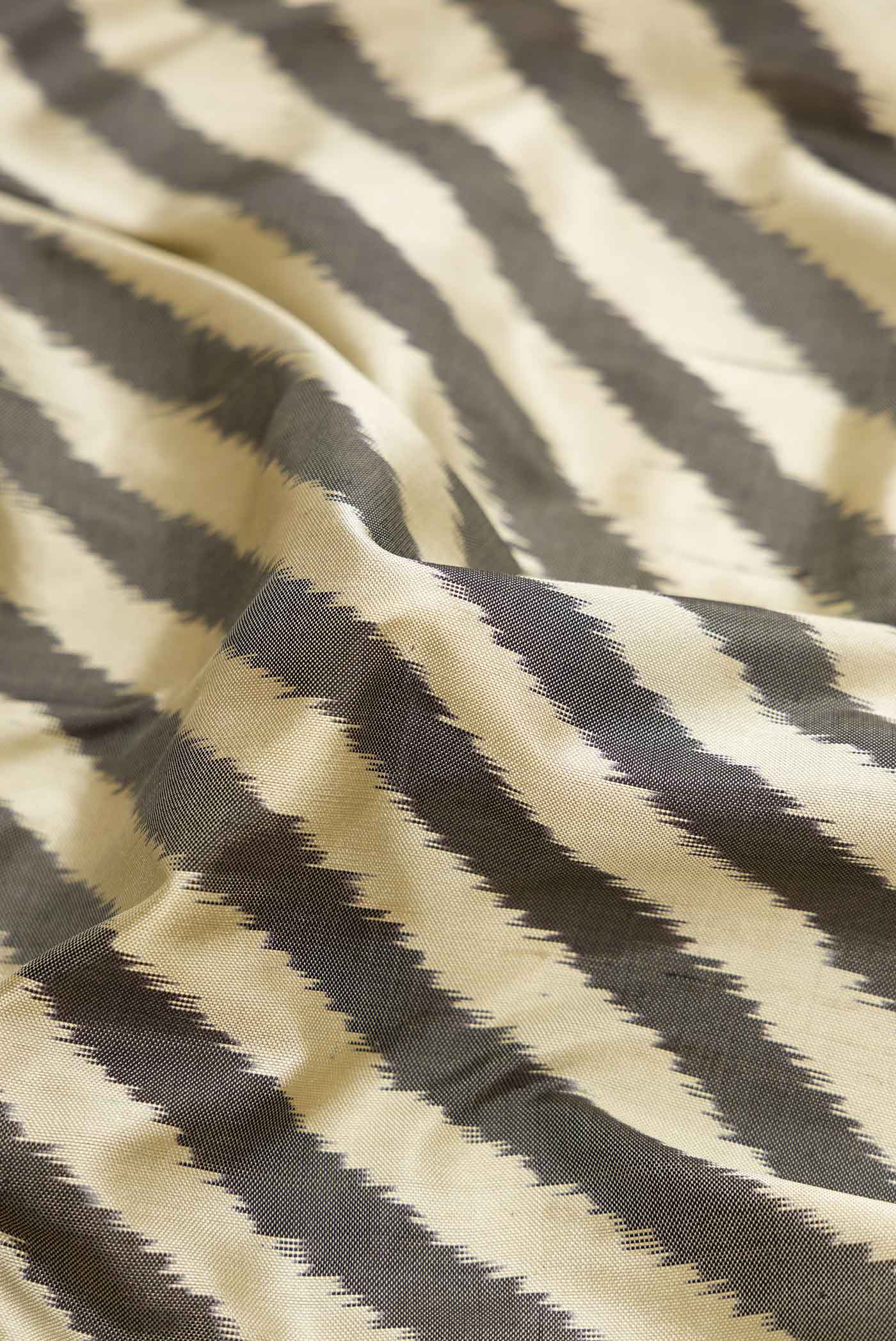 Close up of Multi Color Pochampally Silk Saree with Pure Ikat on the body and Zari Border displaying folds
