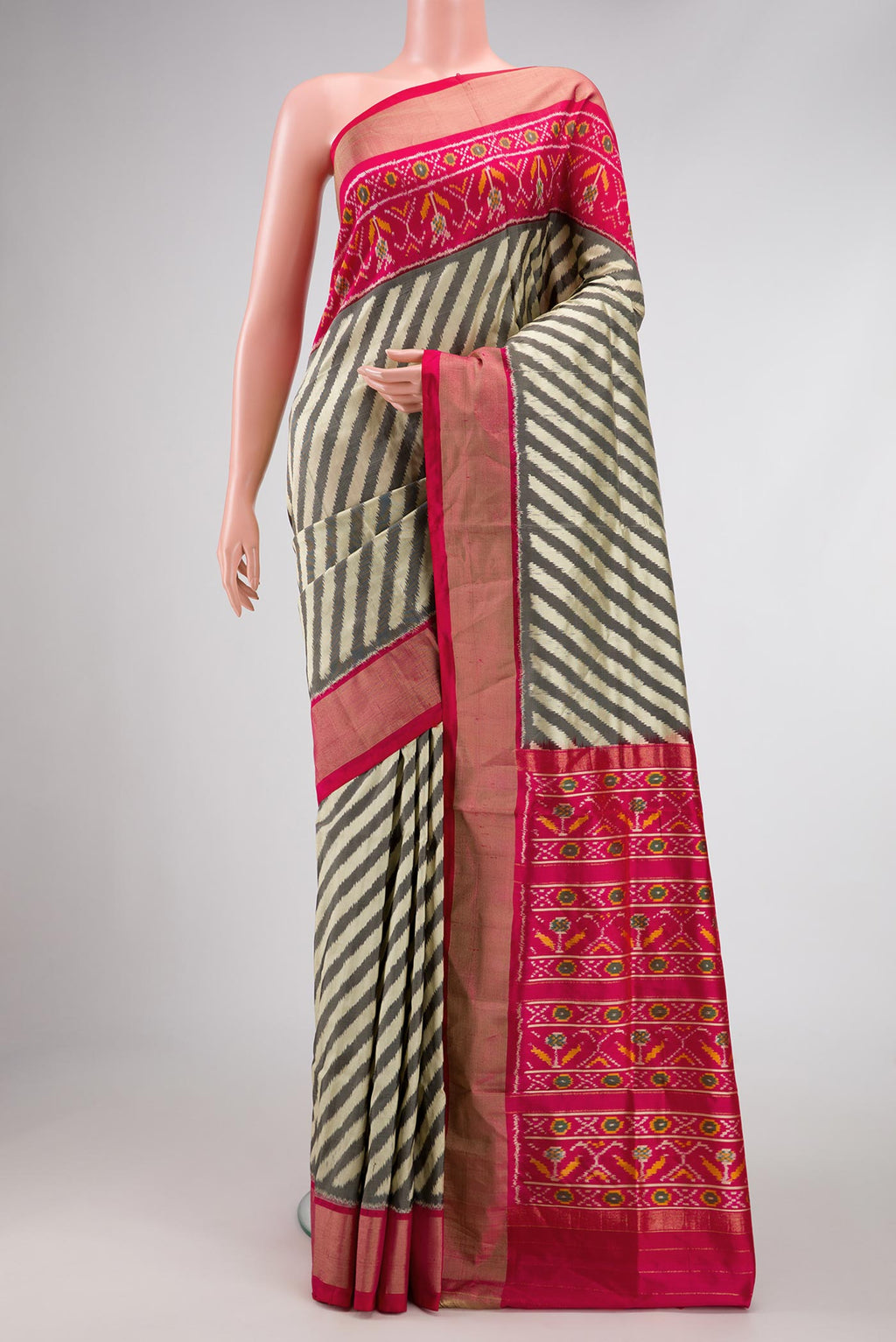 Multi Color Pochampally Silk Saree with Pure Ikat on the body and Zari Border displayed on a mannequin