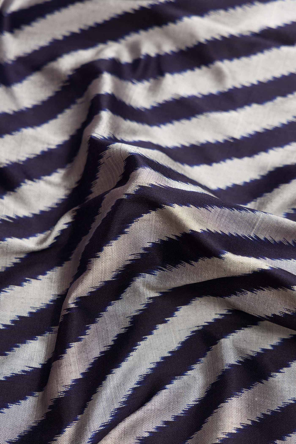 Close up of Multi Color Pochampally Silk Saree with Pure Ikat on the body and Zari Border displaying folds