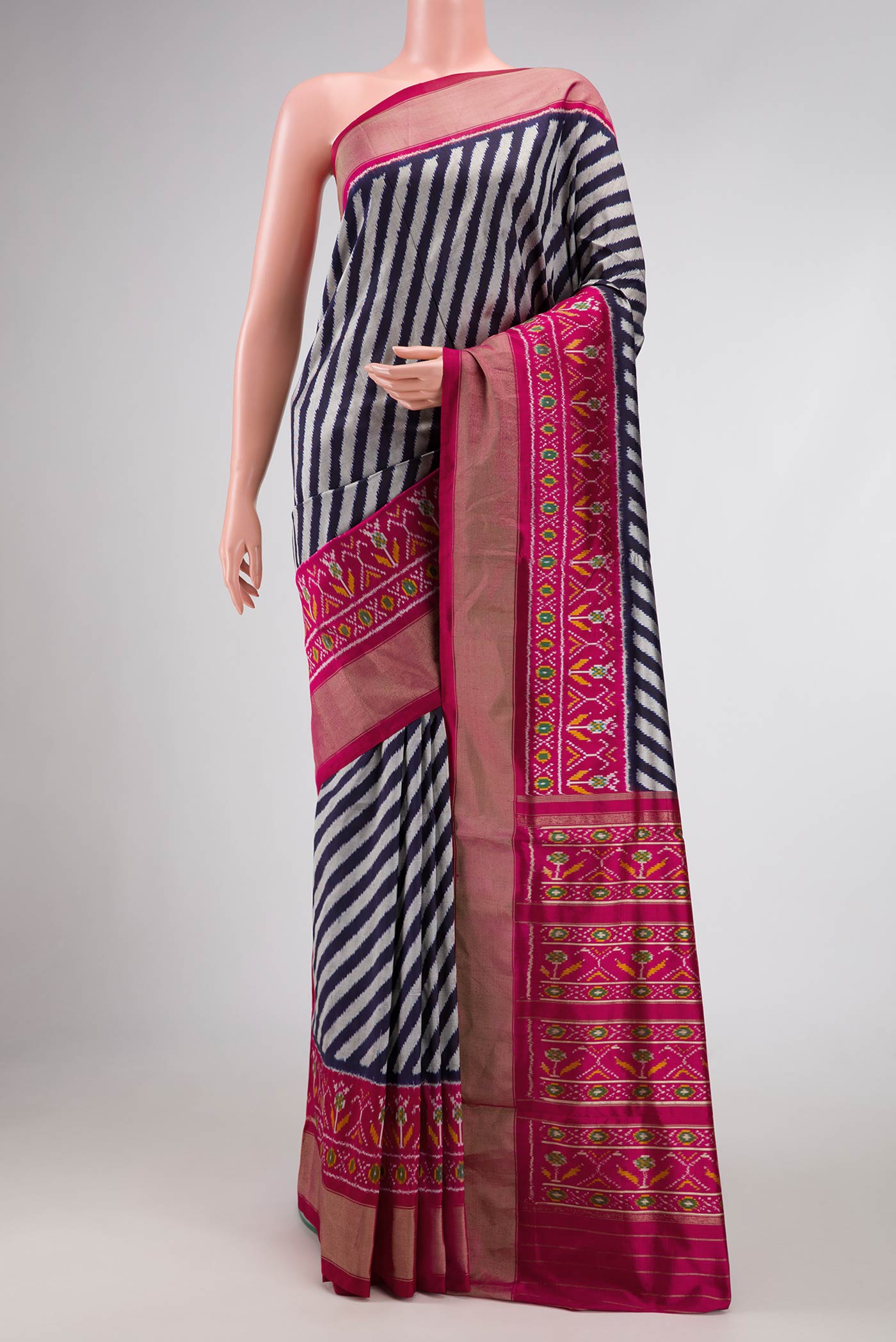 Multi Color Pochampally Silk Saree with Pure Ikat on the body and Zari Border displayed on a mannequin