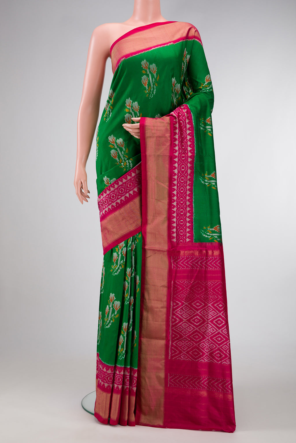 Green Dual Tone Double Ikat Saree with Ikat Print on the body and Ikat Border.  displayed on a mannequin