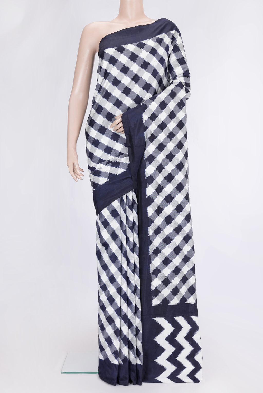Parrot Green Dual Tone Double Ikat Saree with Ikat Print on the body and Ikat Border.  displayed on a mannequin