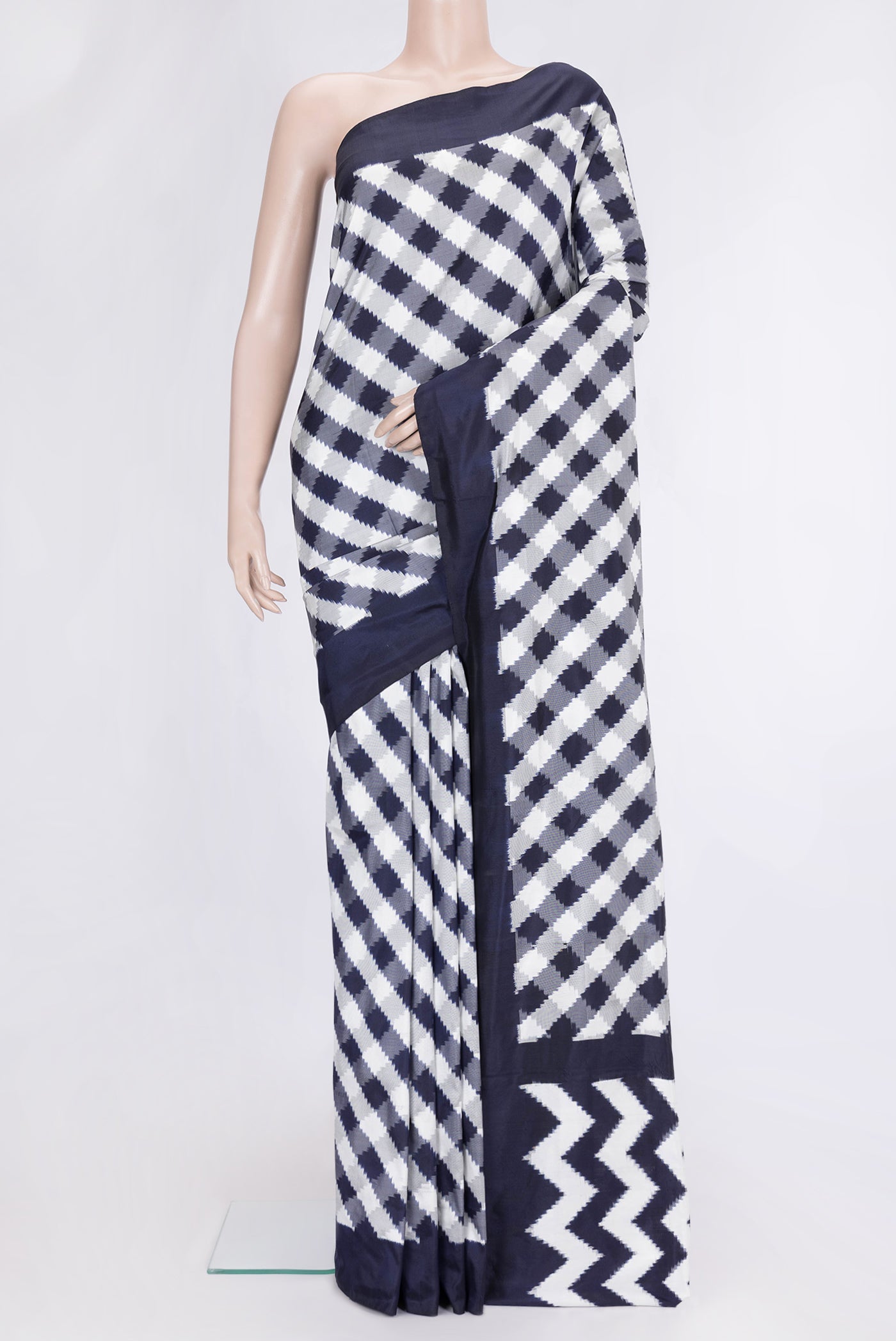 Parrot Green Dual Tone Double Ikat Saree with Ikat Print on the body and Ikat Border.  displayed on a mannequin