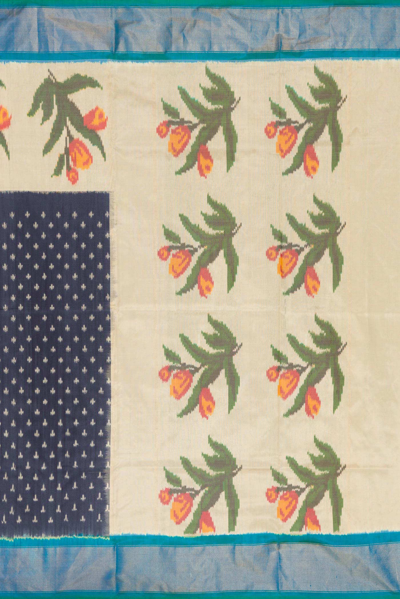 Close up image of the pallu of Navy Blue Dual Tone Double Ikat Saree with Ikat Print on the body and Zari Border. 