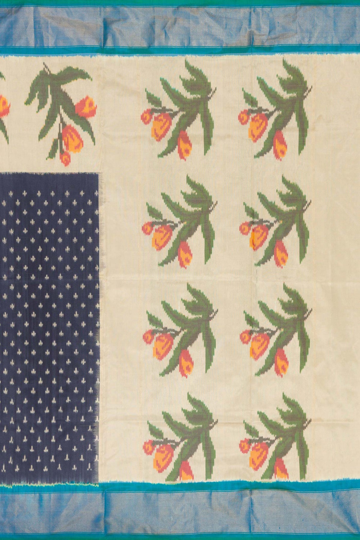 Close up image of the pallu of Navy Blue Dual Tone Double Ikat Saree with Ikat Print on the body and Zari Border. 