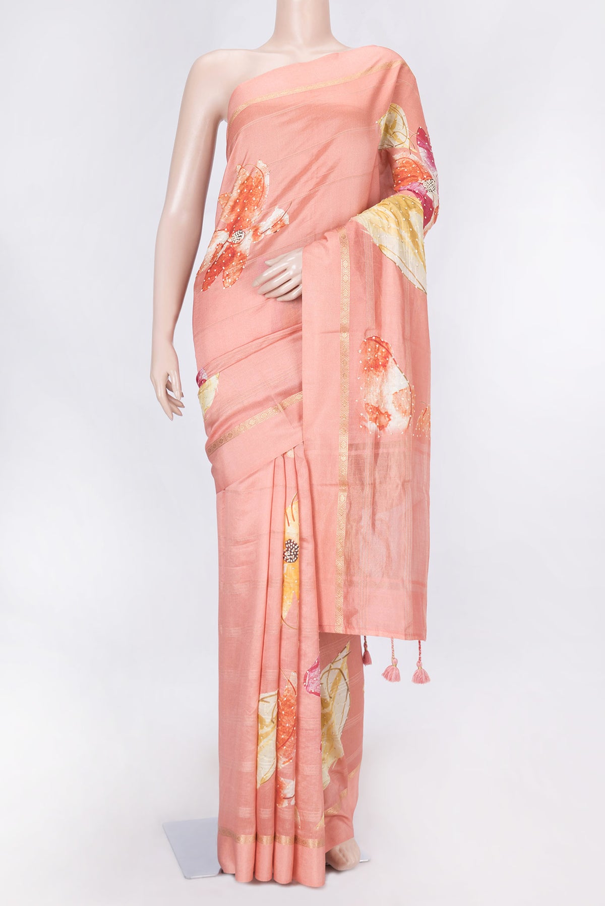 Peach Dual Tone Tussar Silk Saree with Embroidery on the body and Zari Border displayed on a mannequin