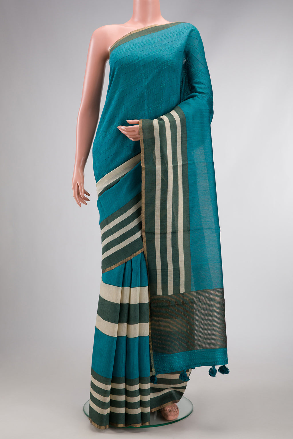 Peacock Blue Dual Tone Tussar Silk Saree with Embroidery on the body and Embroidery Border.  displayed on a mannequin