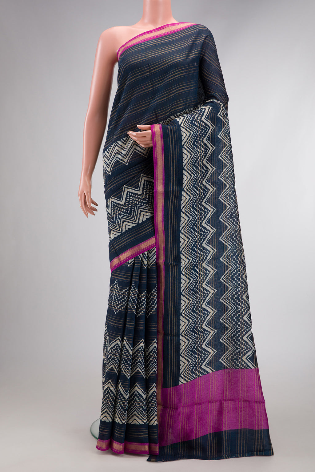 Navy Blue Dual Tone Tussar Silk Saree with Printed design on the body and Zari Border.  displayed on a mannequin