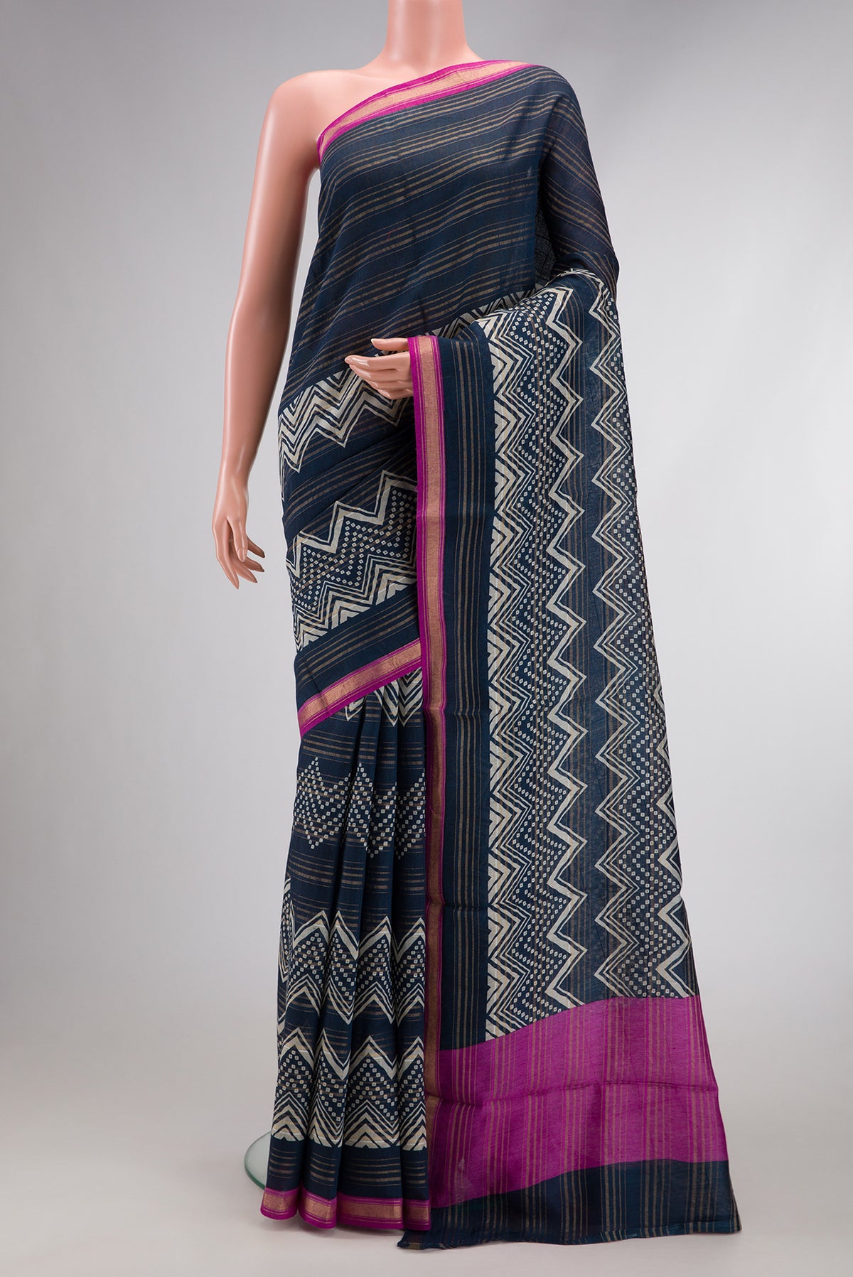 Navy Blue Dual Tone Tussar Silk Saree with Printed design on the body and Zari Border.  displayed on a mannequin