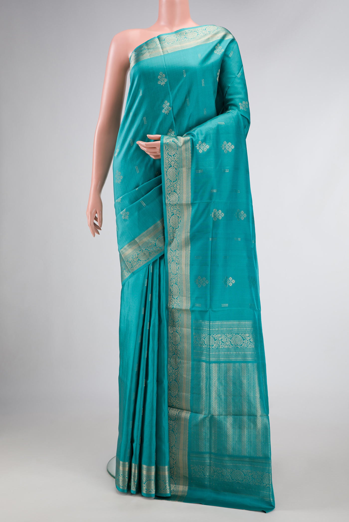 Sky Blue Dual Tone Soft Silk Saree with Zari Butta on the body and Zari Border.  displayed on a mannequin
