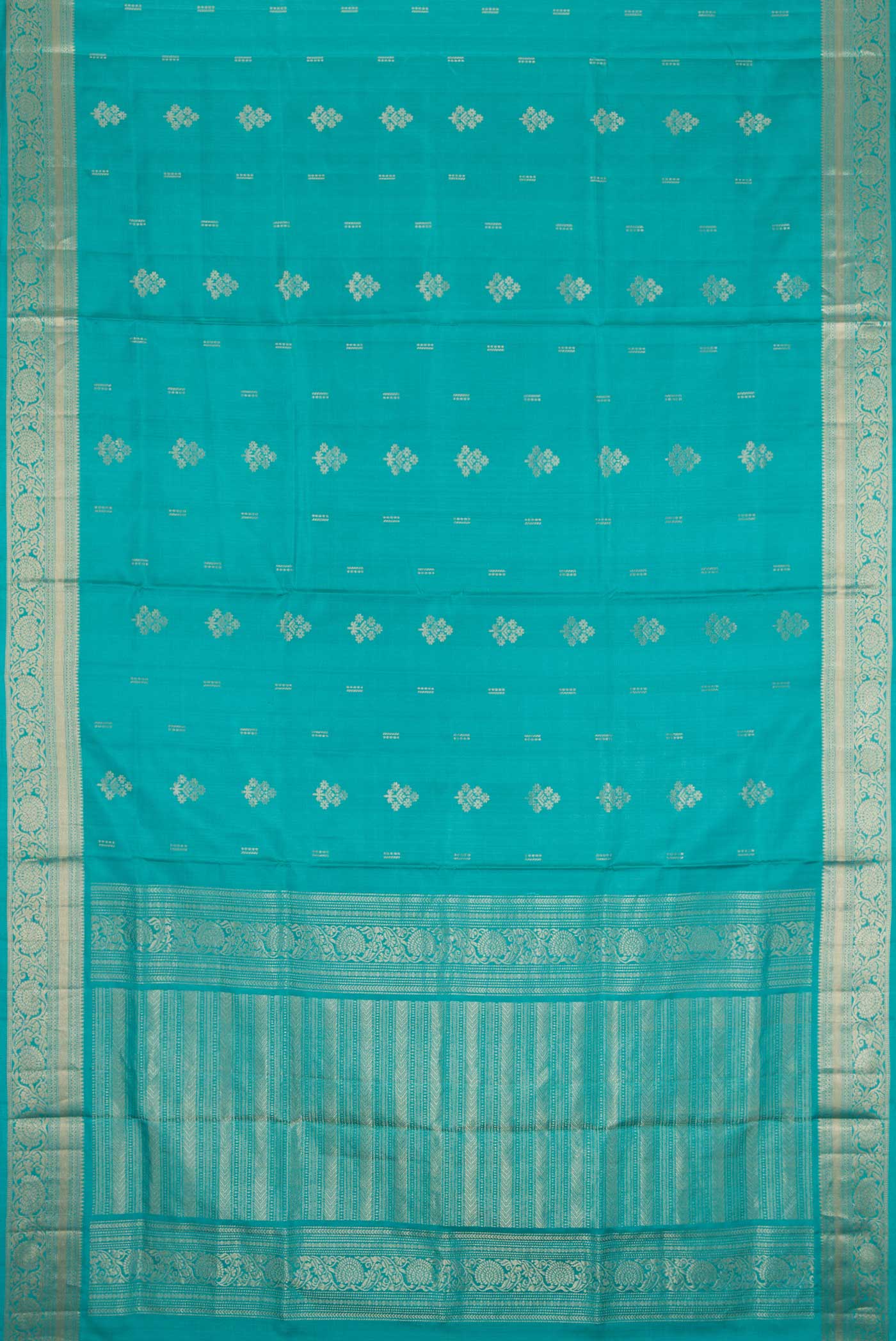 Flat view of Sky Blue Dual Tone Soft Silk Saree with Zari Butta on the body and Zari Border. 
