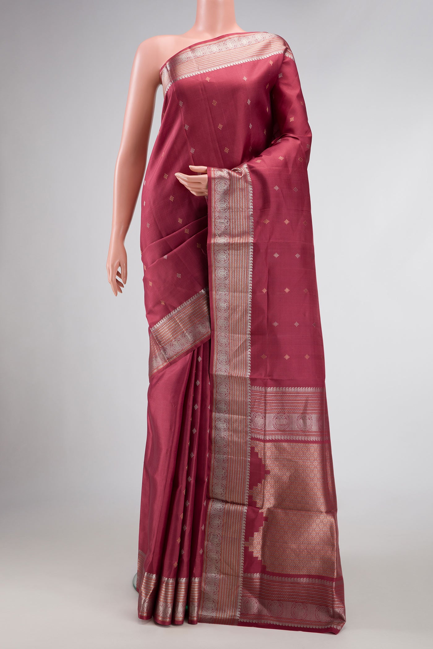 Maroon Dual Tone Soft Silk Saree with Zari Butta on the body and Zari Border.  displayed on a mannequin