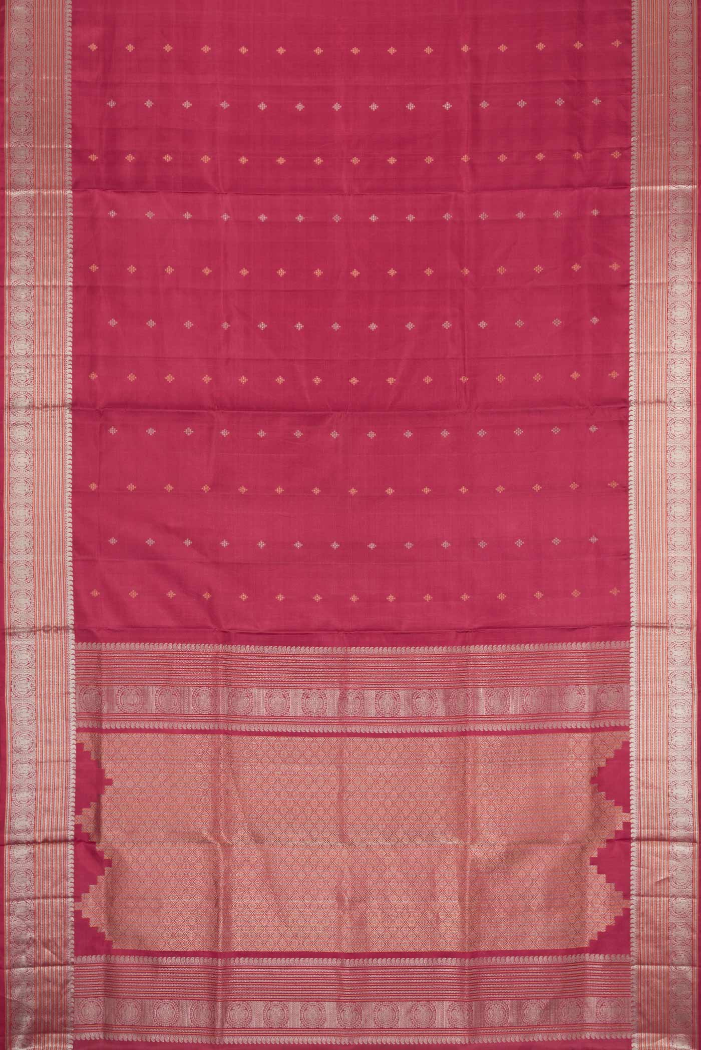 Flat view of Maroon Dual Tone Soft Silk Saree with Zari Butta on the body and Zari Border. 