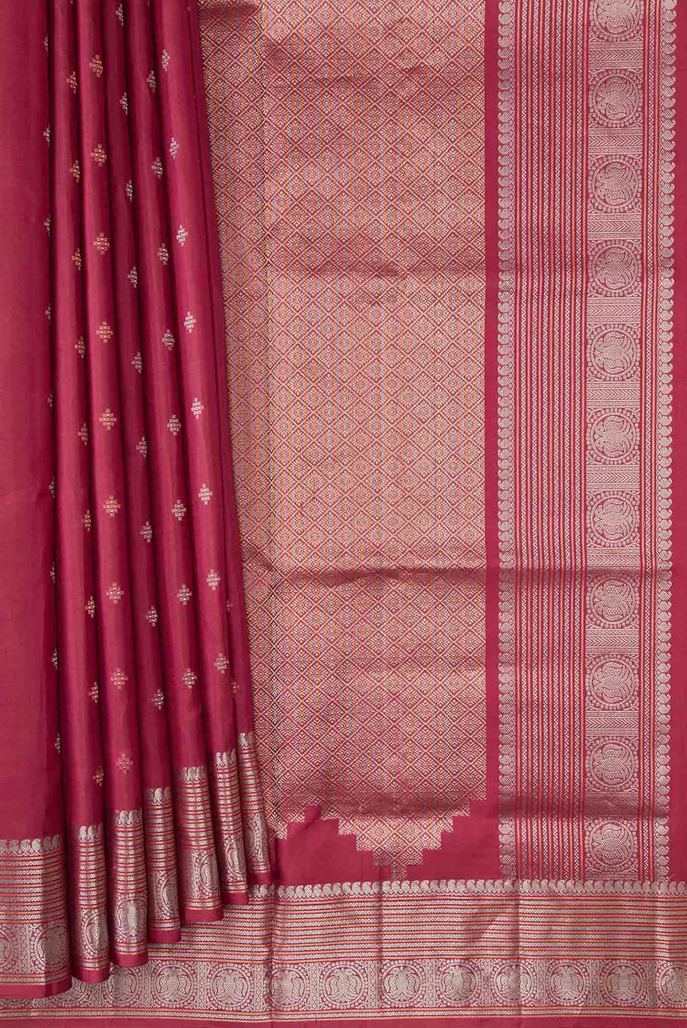 Pleats and pallu of Maroon Dual Tone Soft Silk Saree with Zari Butta on the body and Zari Border. 