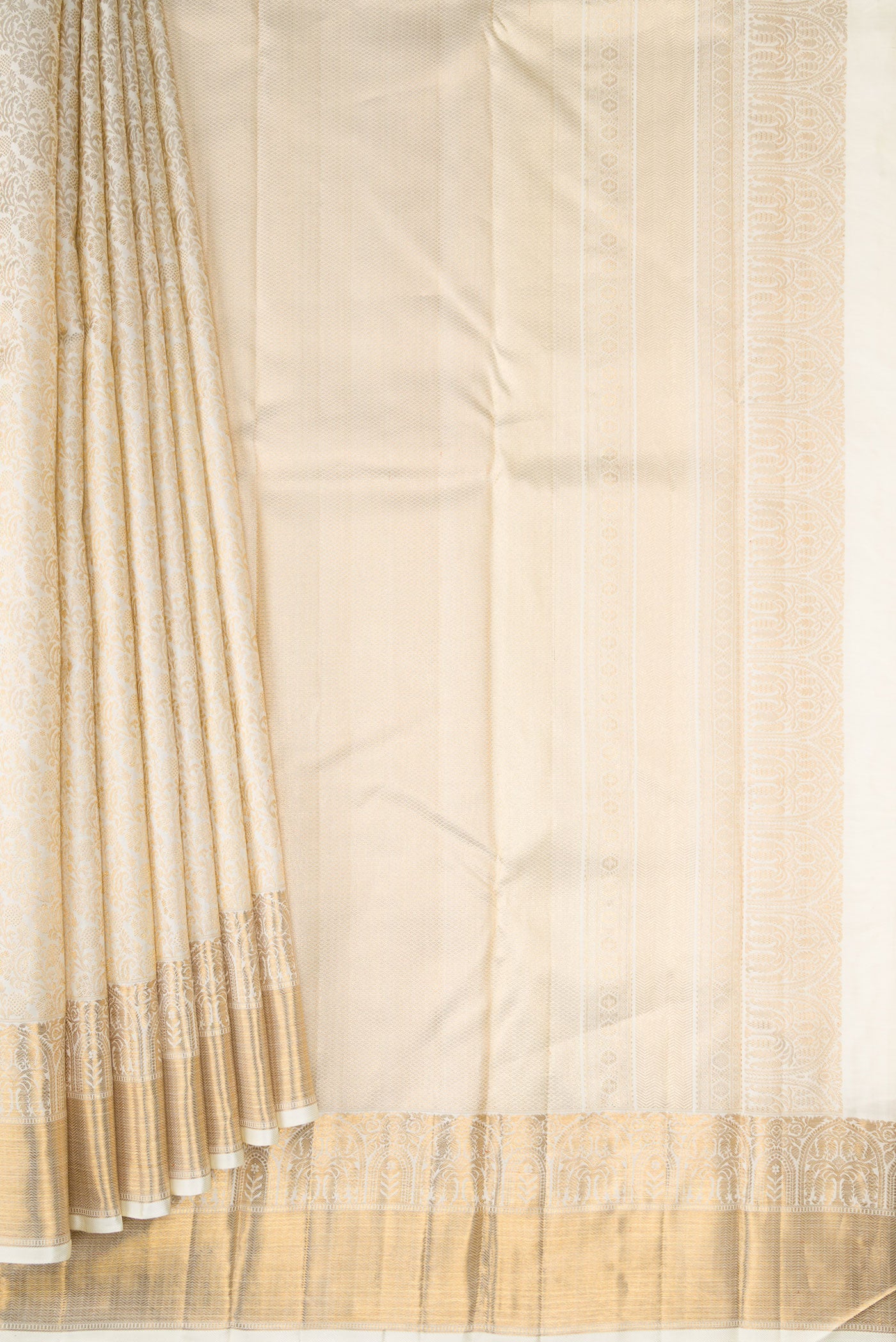 Pleats and pallu of Off White Dual Tone Kanchipuram Silk Saree with Zari Brocade on the body and Zari Border. 