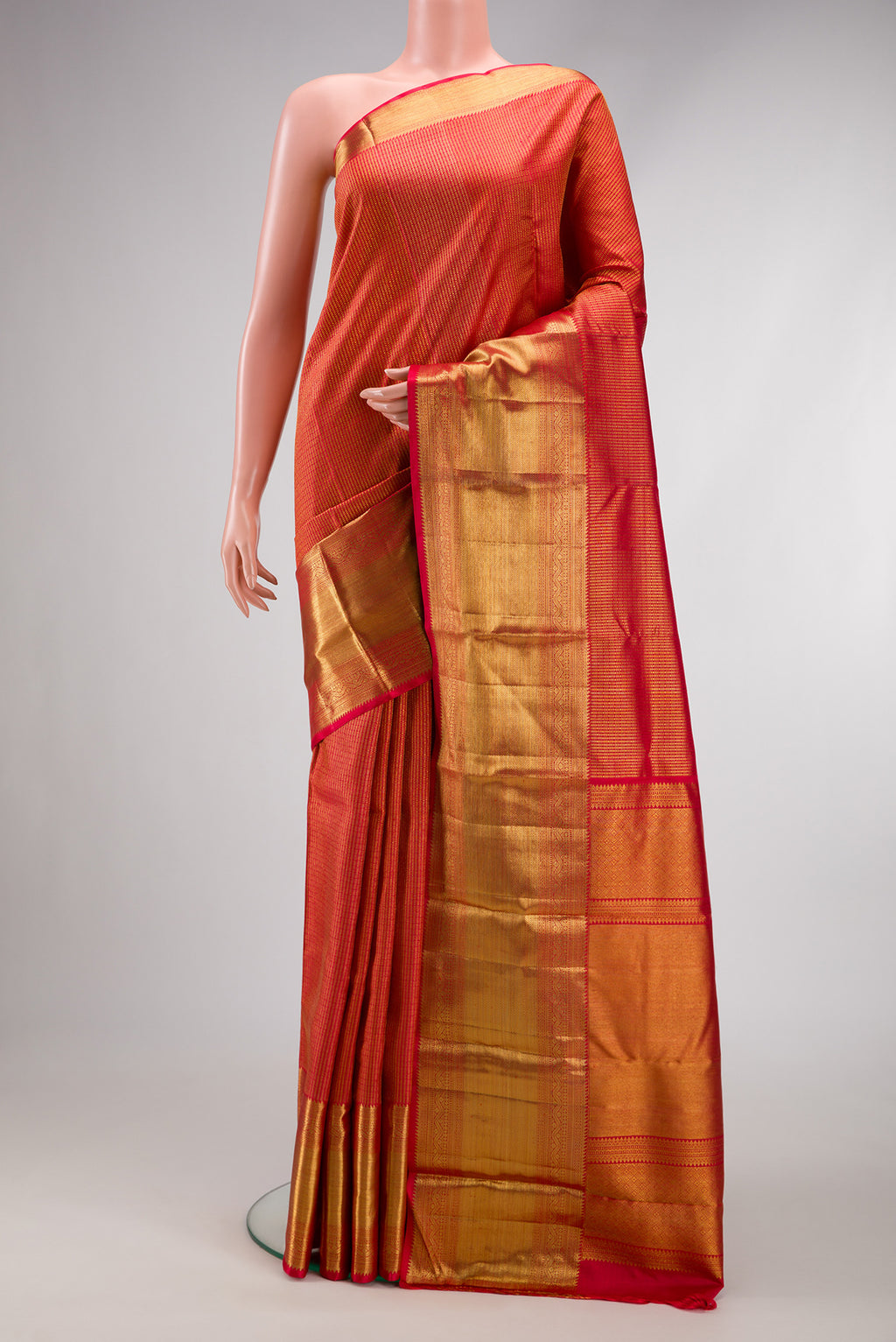 Red Dual Tone Kanchipuram Silk Saree with Zari Brocade on the body and Zari Border.  displayed on a mannequin