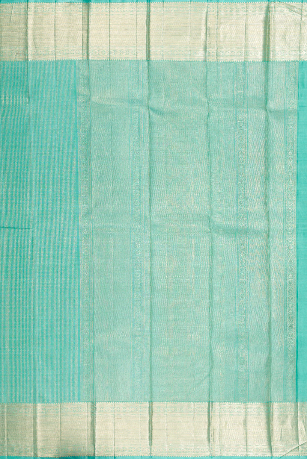 Close up image of the pallu of Sea Green Kanchipuram Silk Saree with Zari Brocade on the body and Zari Border. 