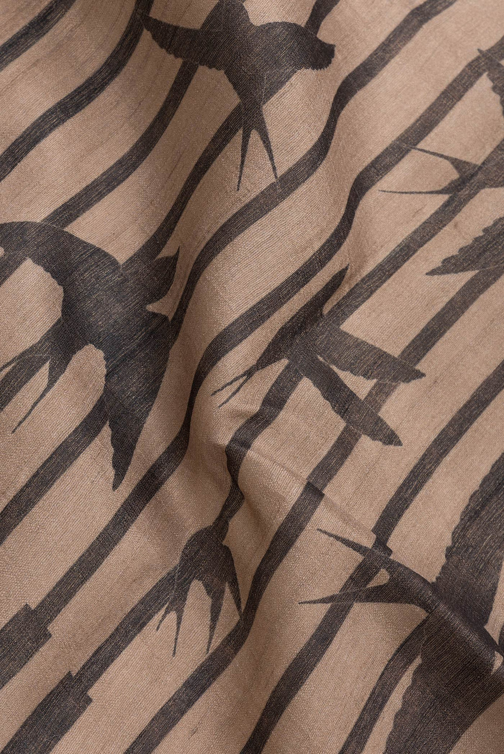 Close up of Brown Dual Tone Tussar Silk Saree with Stripes on the body and Without Border.  displaying folds