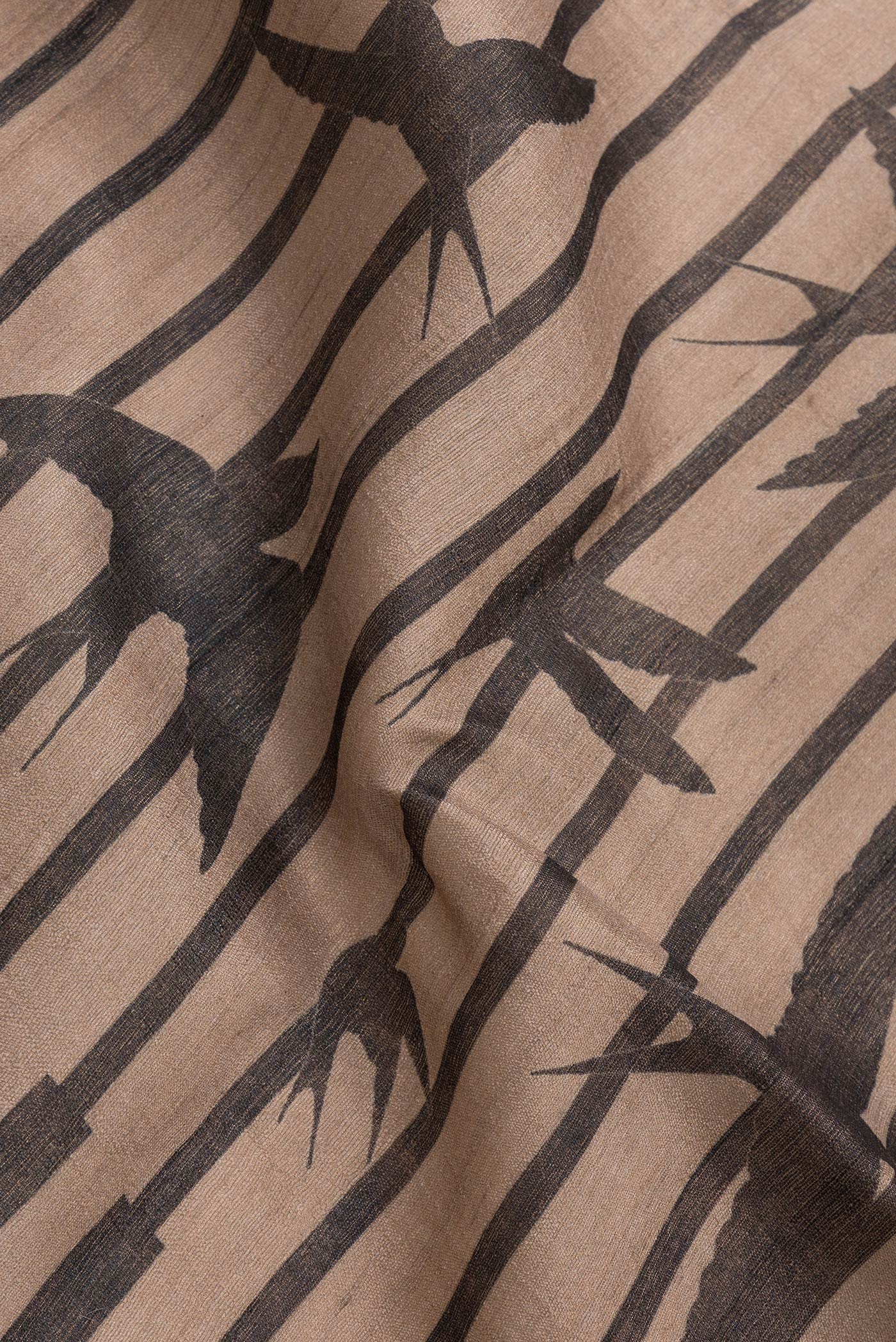 Close up of Brown Dual Tone Tussar Silk Saree with Stripes on the body and Without Border.  displaying folds