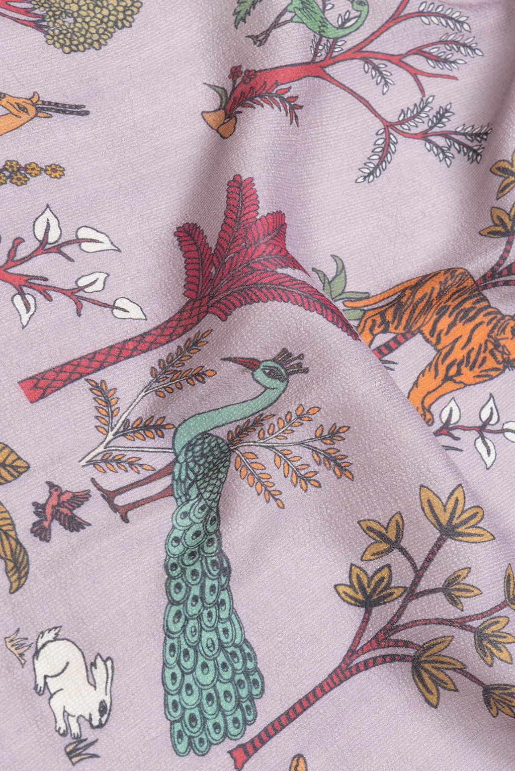 Close up of Lavender Dual Tone Tussar Silk Saree with Printed design on the body and Zari Border.  displaying folds