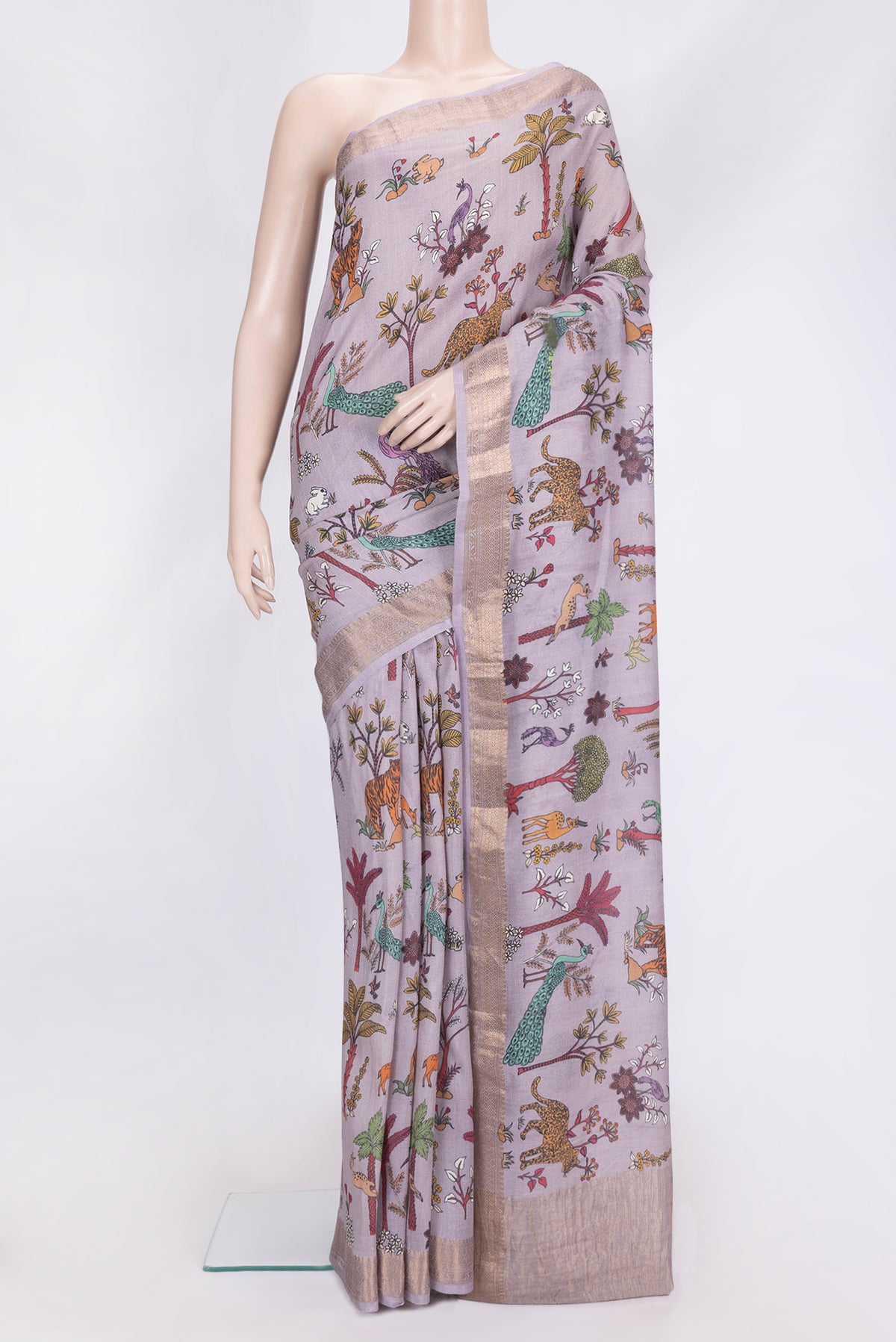 Lavender Dual Tone Tussar Silk Saree with Printed design on the body and Zari Border.  displayed on a mannequin