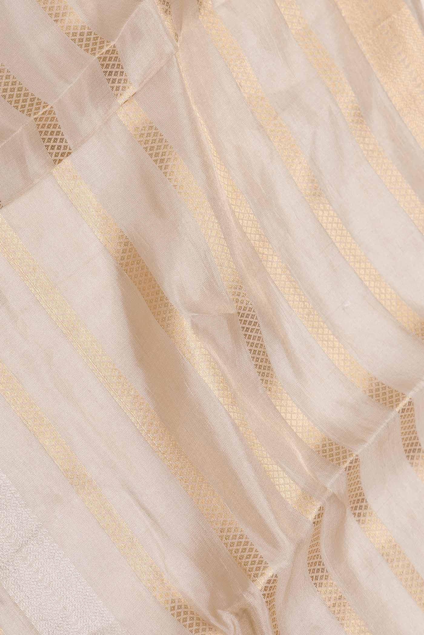 Close up of Gold Dual Tone Organza Silk Saree with Zari Brocade on the body and Zari Border displaying folds