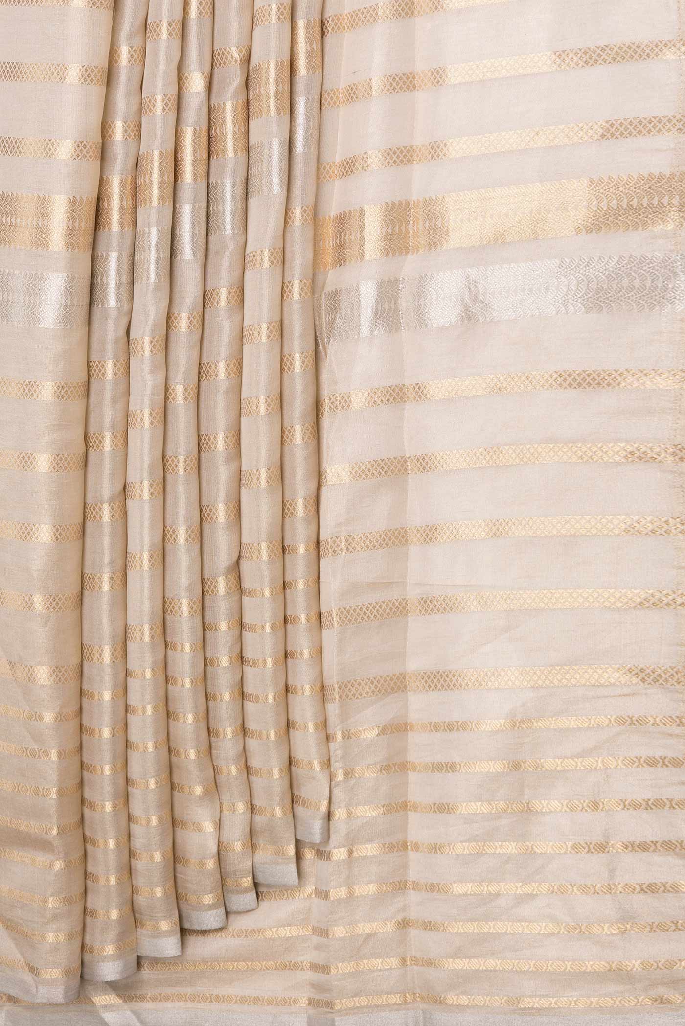 Pleats and pallu of Gold Dual Tone Organza Silk Saree with Zari Brocade on the body and Zari Border