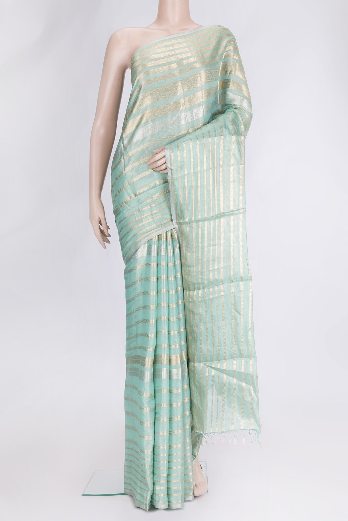 Sea Green Dual Tone Organza Silk Saree with Stripes on the body and Zari Border.  displayed on a mannequin