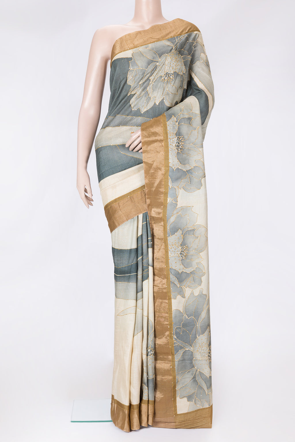 Beige Dual Tone Tussar Silk Saree with Printed design on the body and Zari Border.  displayed on a mannequin