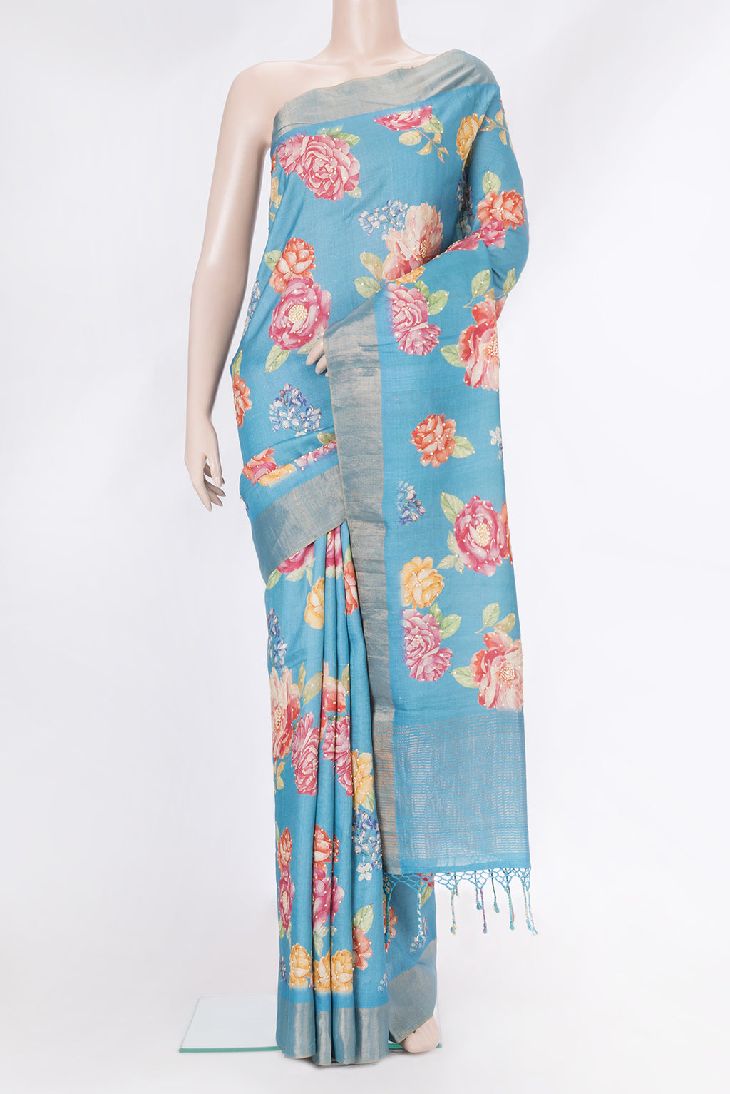 Sky Blue Dual Tone Tussar Silk Saree with Embroidery on the body and Zari Border.  displayed on a mannequin