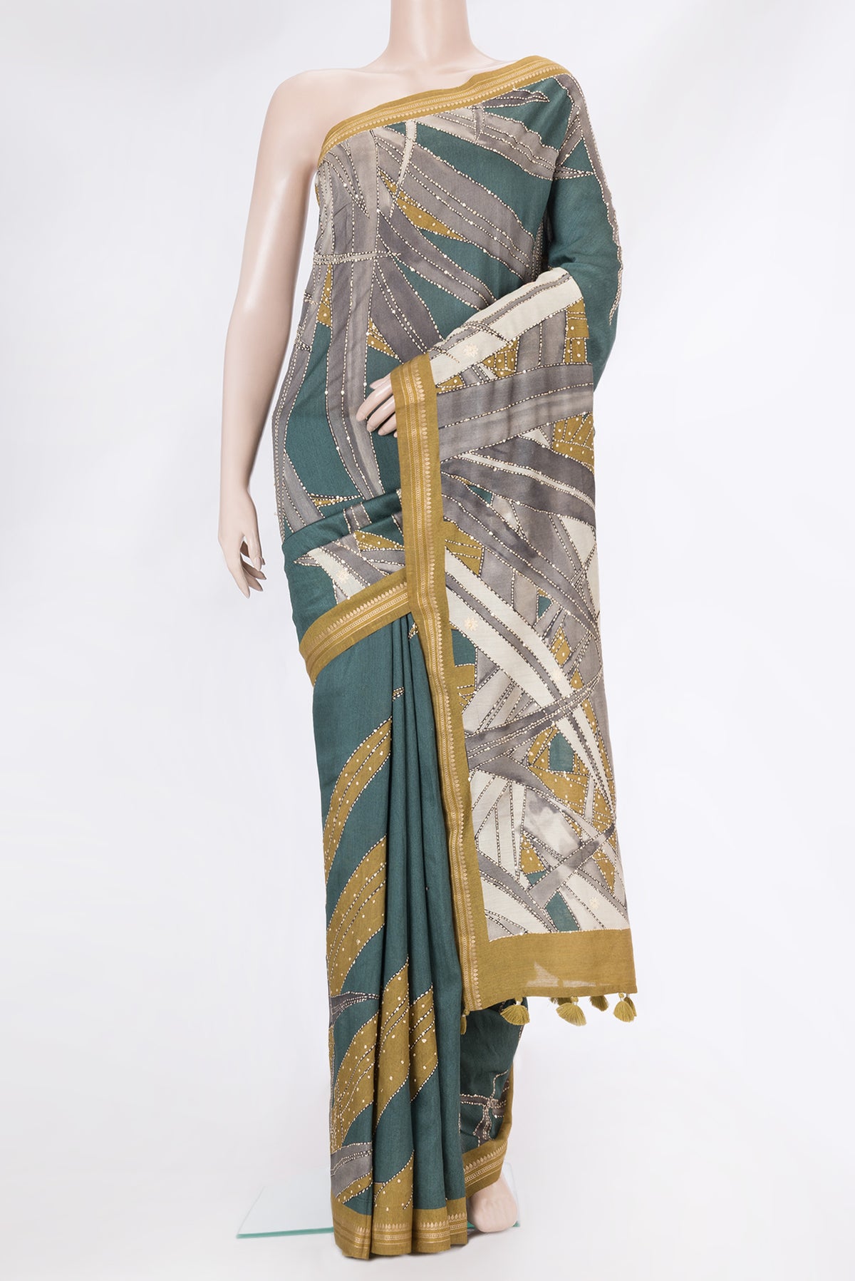 Mehandi Green Dual Tone Tussar Silk Saree with Embroidery on the body and Zari Border.  displayed on a mannequin