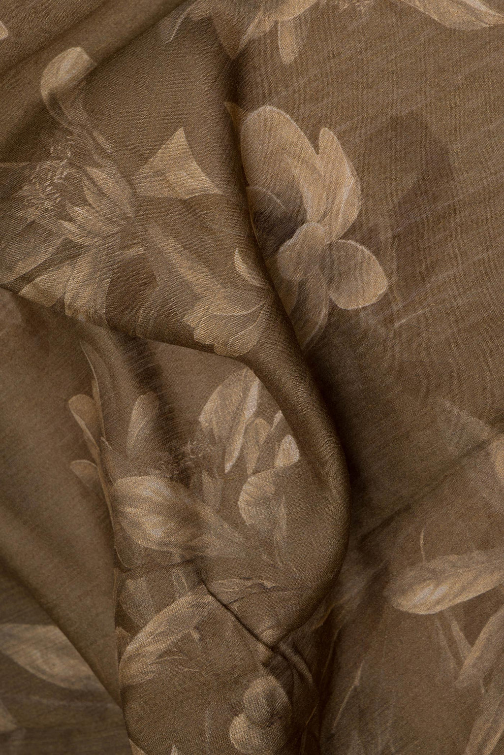 Close up of Mehandi Green Tussar Silk Saree with Embroidery on the body and Zari Border.  displaying folds
