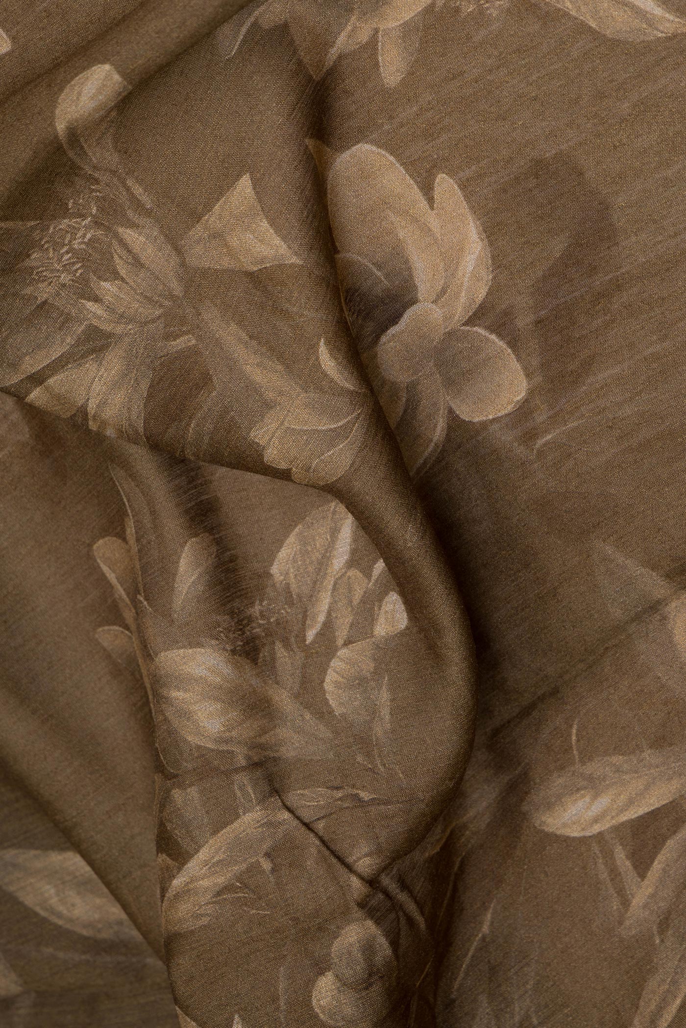 Close up of Mehandi Green Tussar Silk Saree with Embroidery on the body and Zari Border.  displaying folds