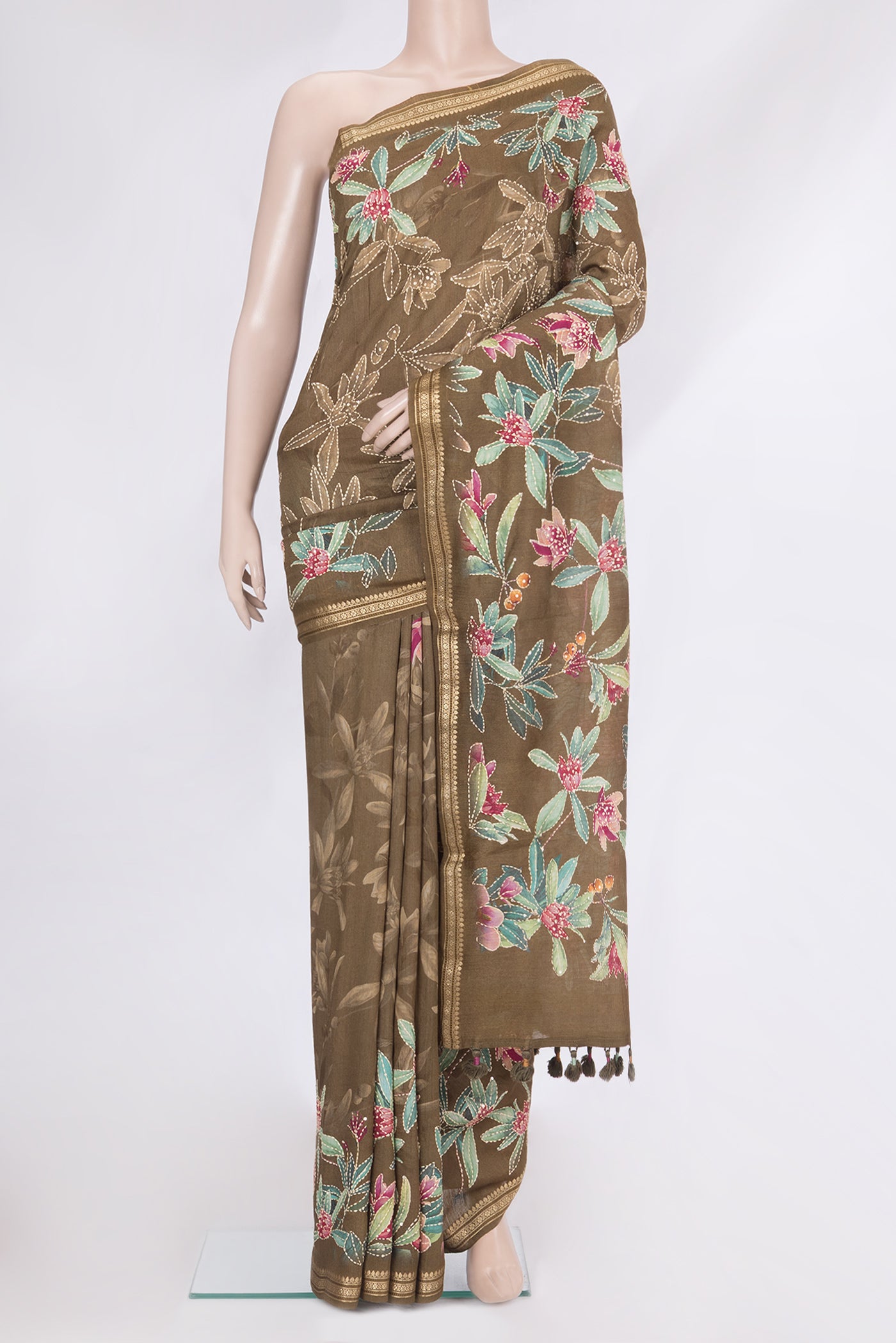 Mehandi Green Tussar Silk Saree with Embroidery on the body and Zari Border.  displayed on a mannequin