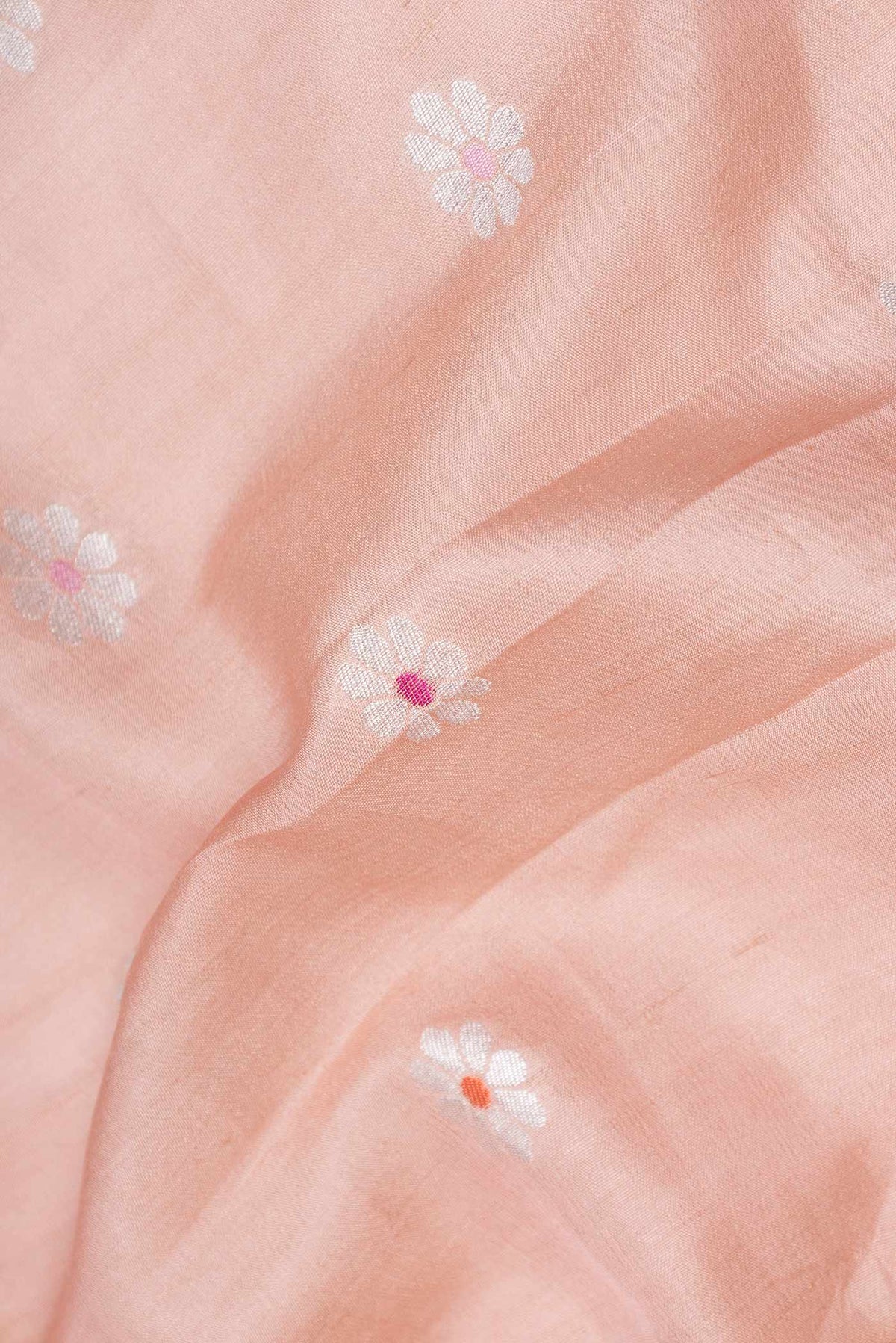 Close up of Pink Dual Tone Tussar Silk Saree with Zari And Thread Butta on the body and Zari Border displaying folds