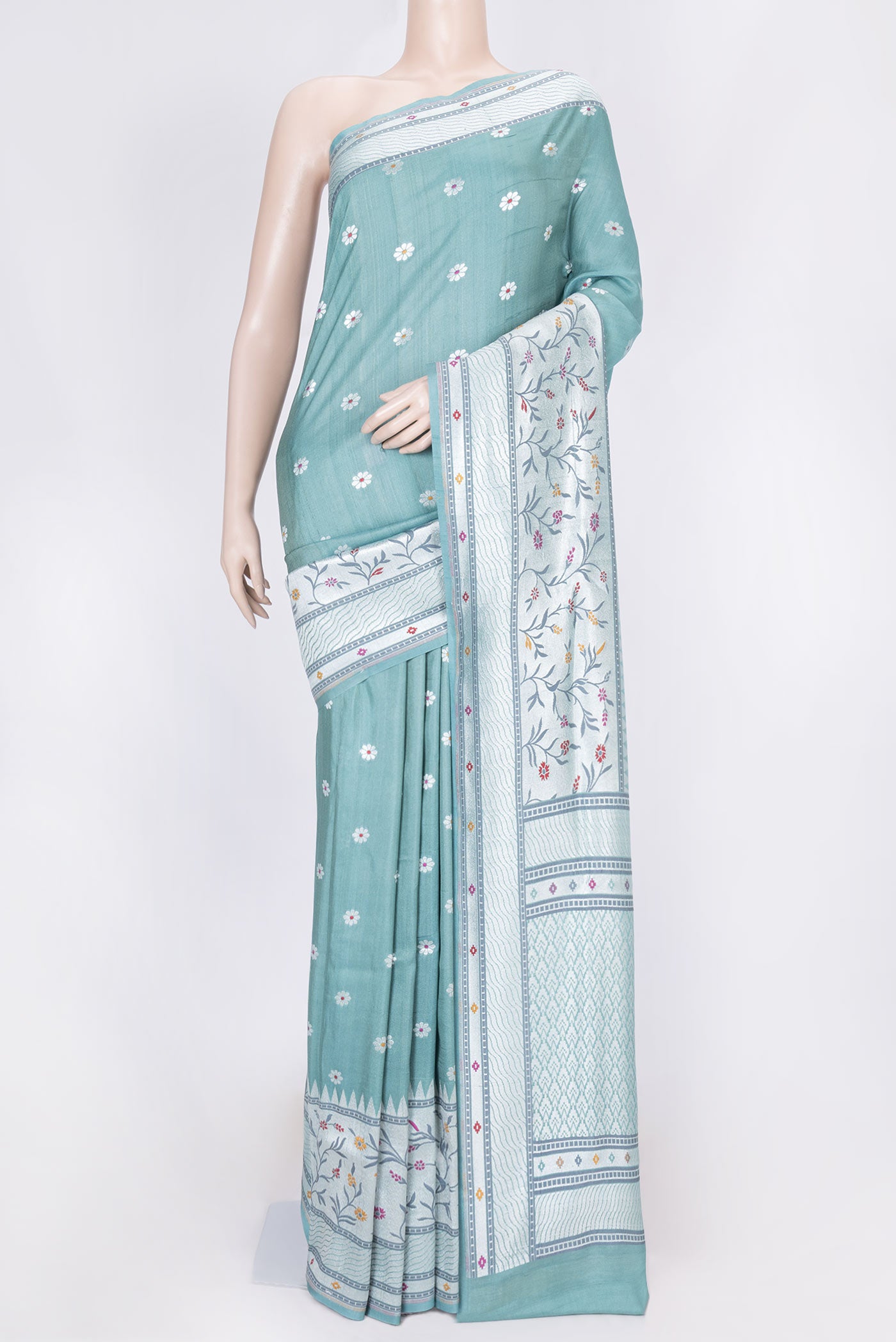 Green Dual Tone Tussar Silk Saree with Zari And Thread Butta on the body and Zari Border displayed on a mannequin