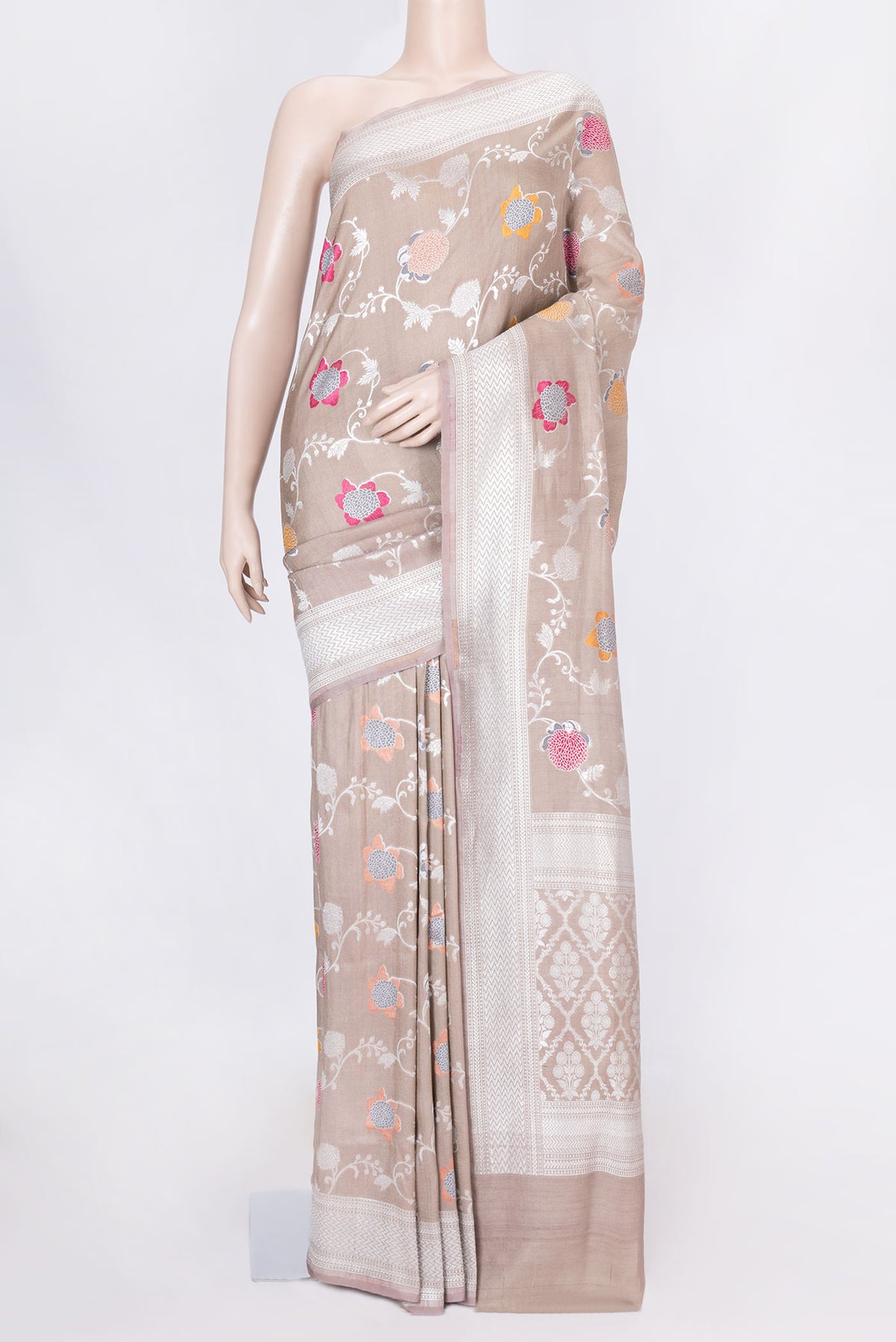Brown Dual Tone Tussar Silk Saree with Zari Brocade on the body and Zari Border displayed on a mannequin