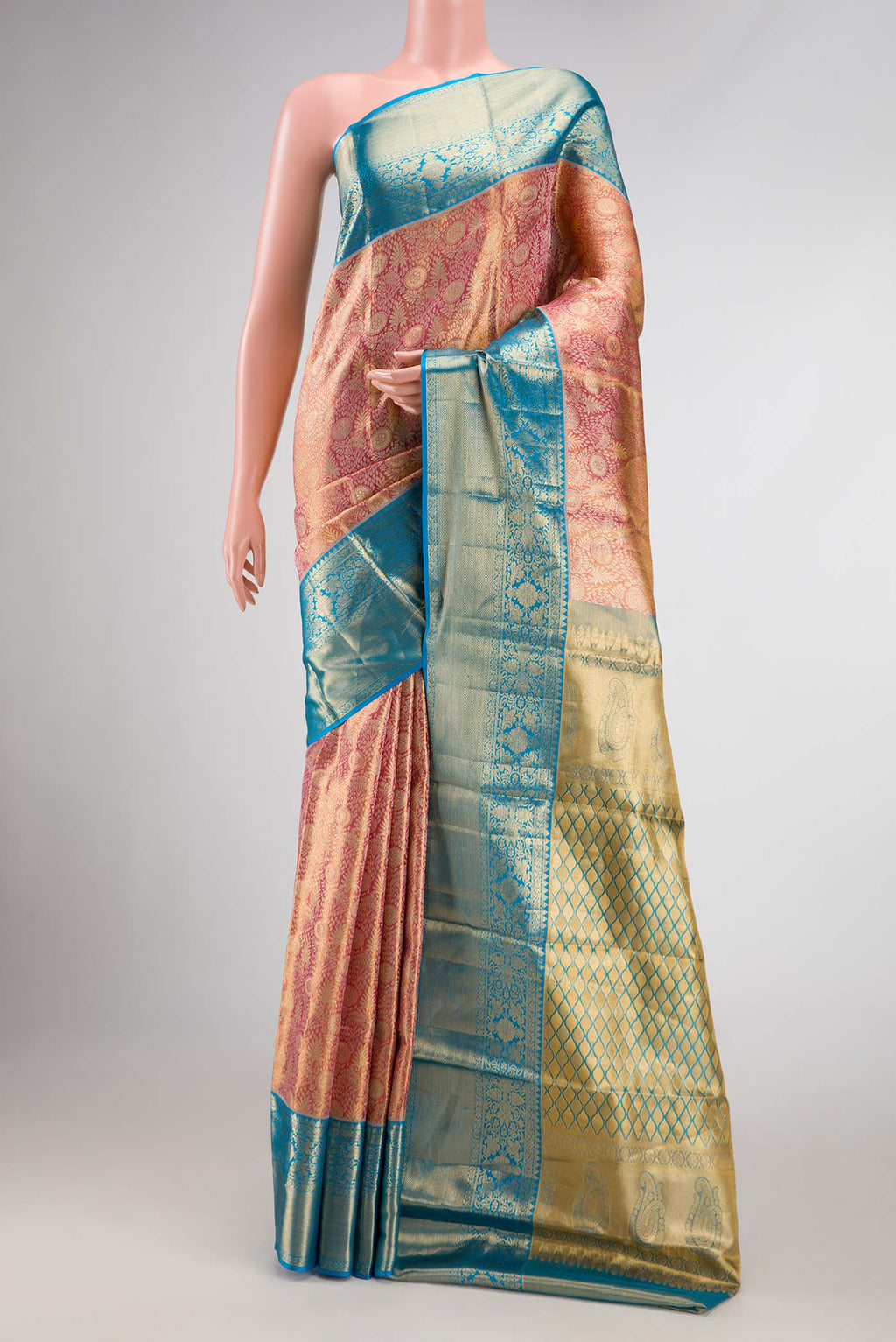 Pink Dual Tone Kanchipuram Tissue Silk Saree with Zari Brocade on the body and Zari Border.  displayed on a mannequin