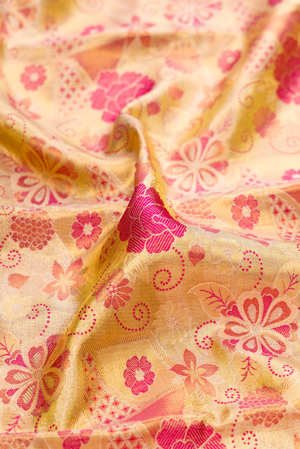 Close up of Gold Dual Tone Kanchipuram Tissue Silk Saree with Zari Brocade on the body and Zari Border.  displaying folds