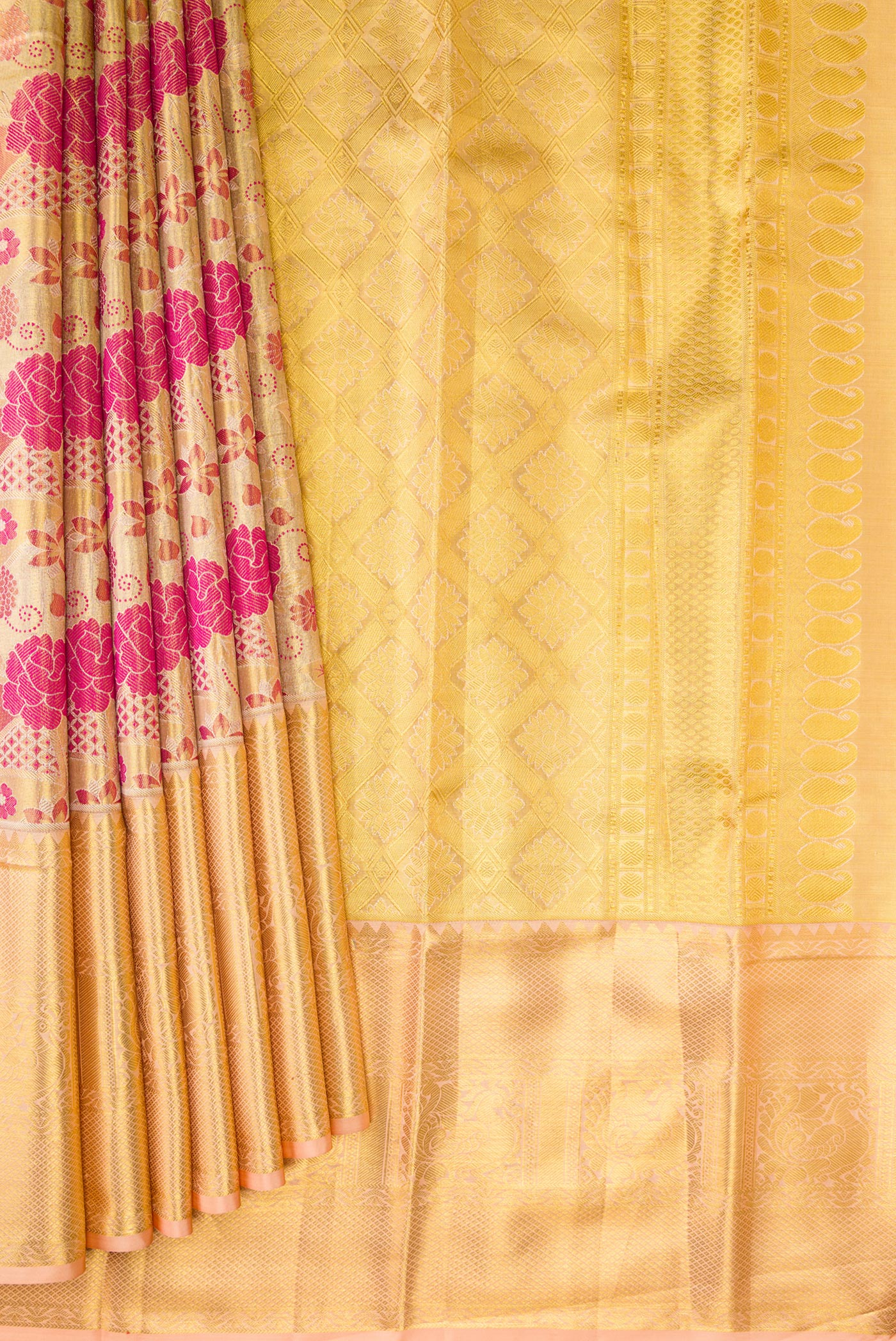 Pleats and pallu of Gold Dual Tone Kanchipuram Tissue Silk Saree with Zari Brocade on the body and Zari Border. 